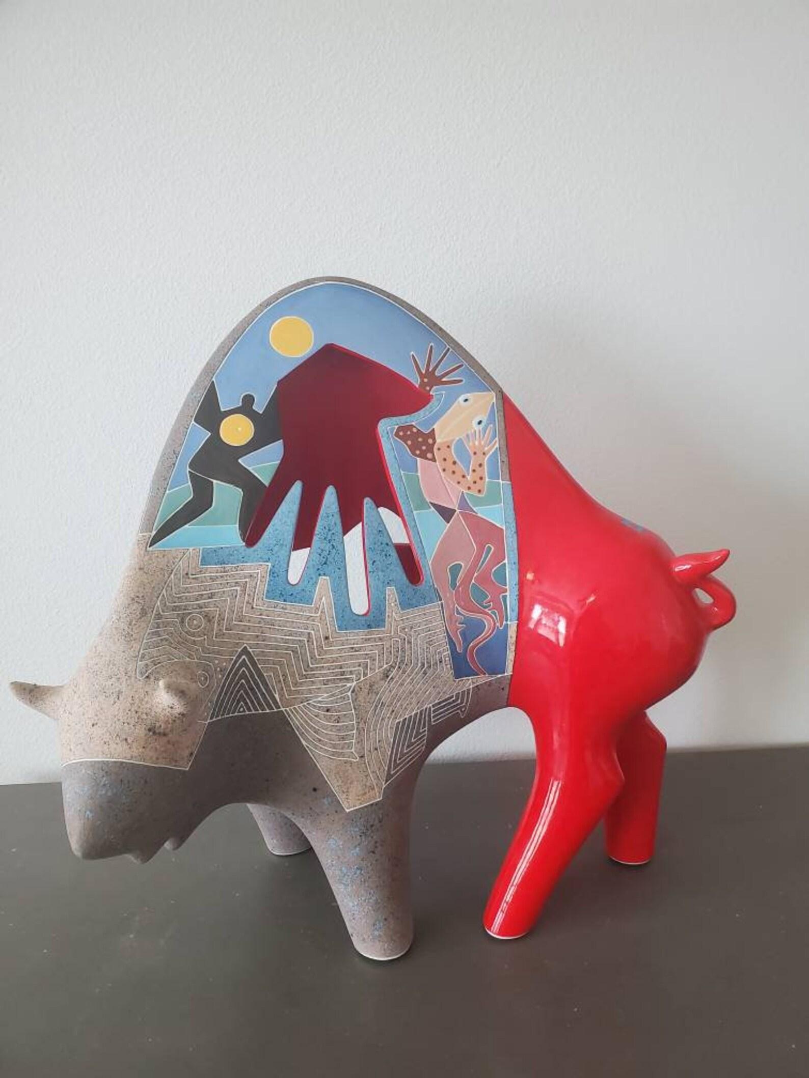 A uniquely brilliant American ceramic sculpture capturing the essence of a buffalo, in southwestern modern style by celebrated husband and wife artists Gene (1945-2006) & Rebecca Tobey (b.1948).

This large sculpture dates to the late 20th