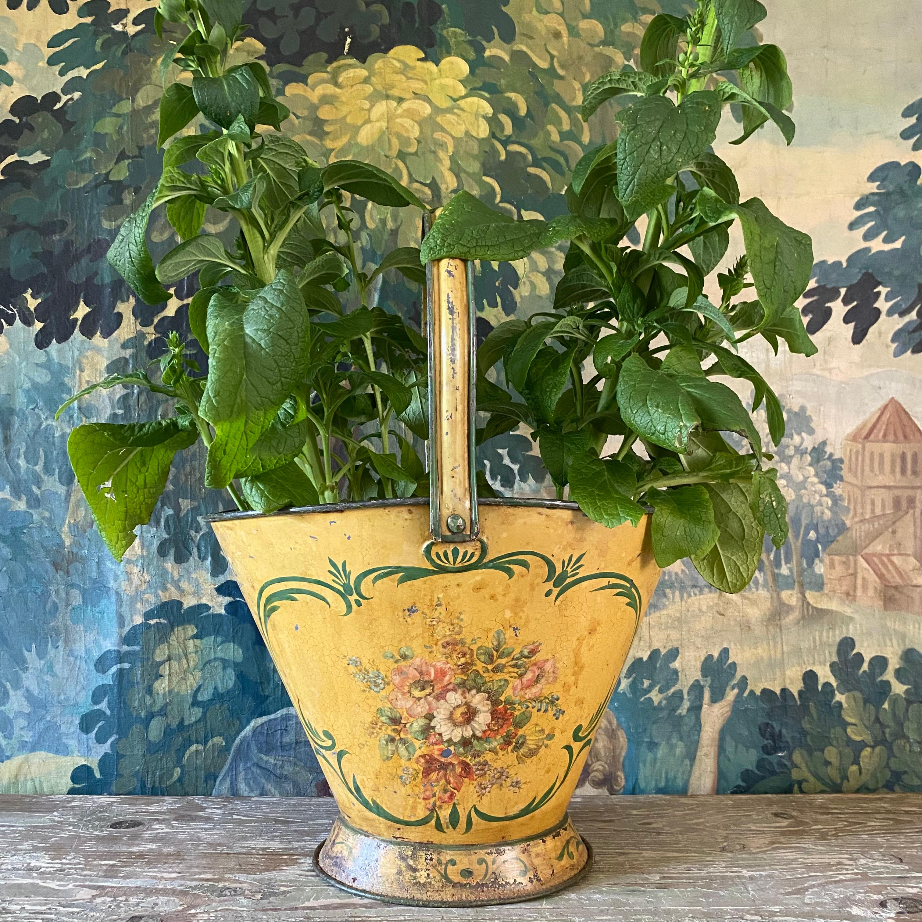 A very large 19th century hand painted toleware flower basket/bucket in the most beautiful colours - a soft yellow background with green lines and predominantly pink and white flowers - hand painted on both sides with various flowers including