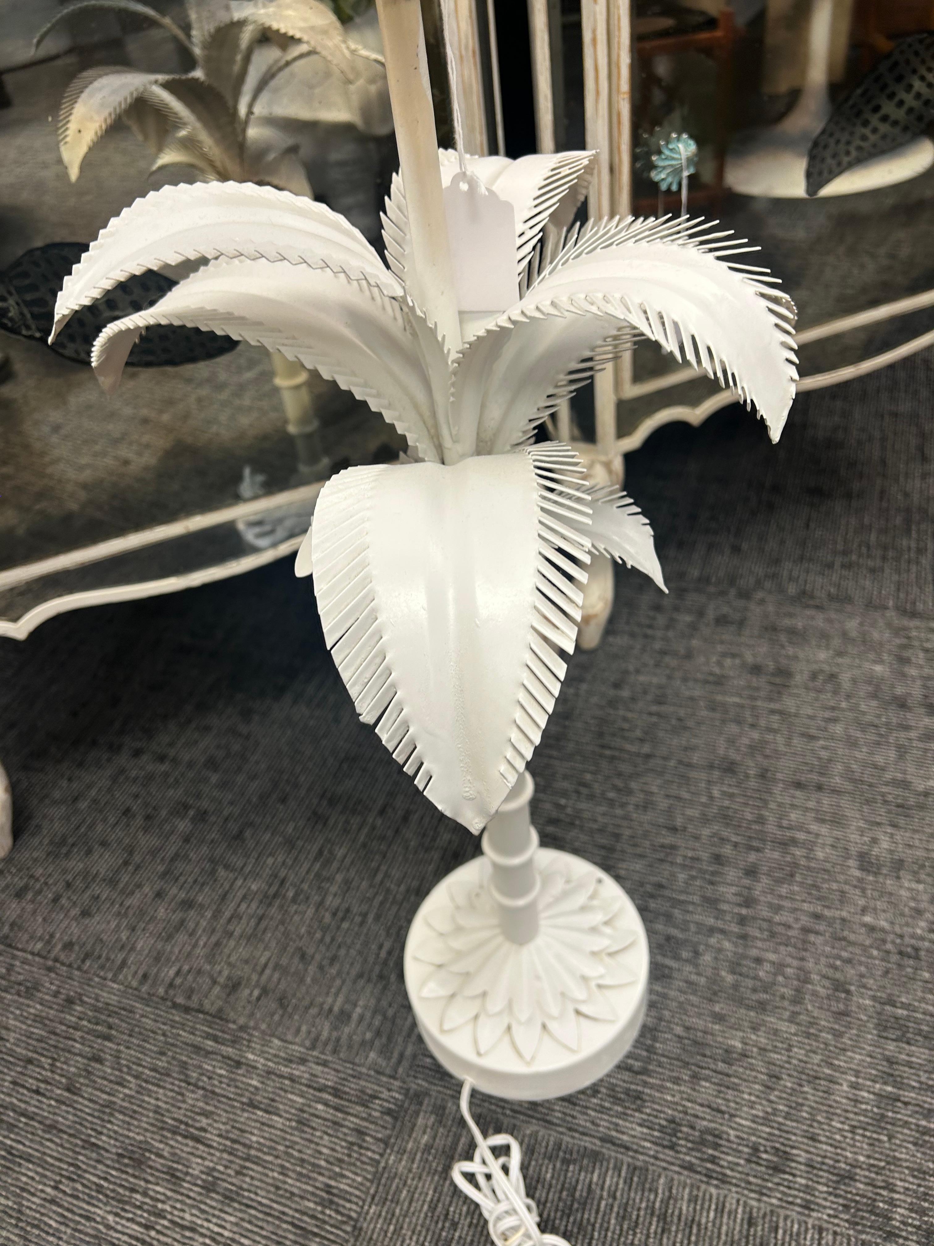 An original condition, white painted toll palm tree lamp… With a segmented trunk and wonderful Palm fronds.. The tall base has applied. Palm leaves as well… This is original condition and very good shape.