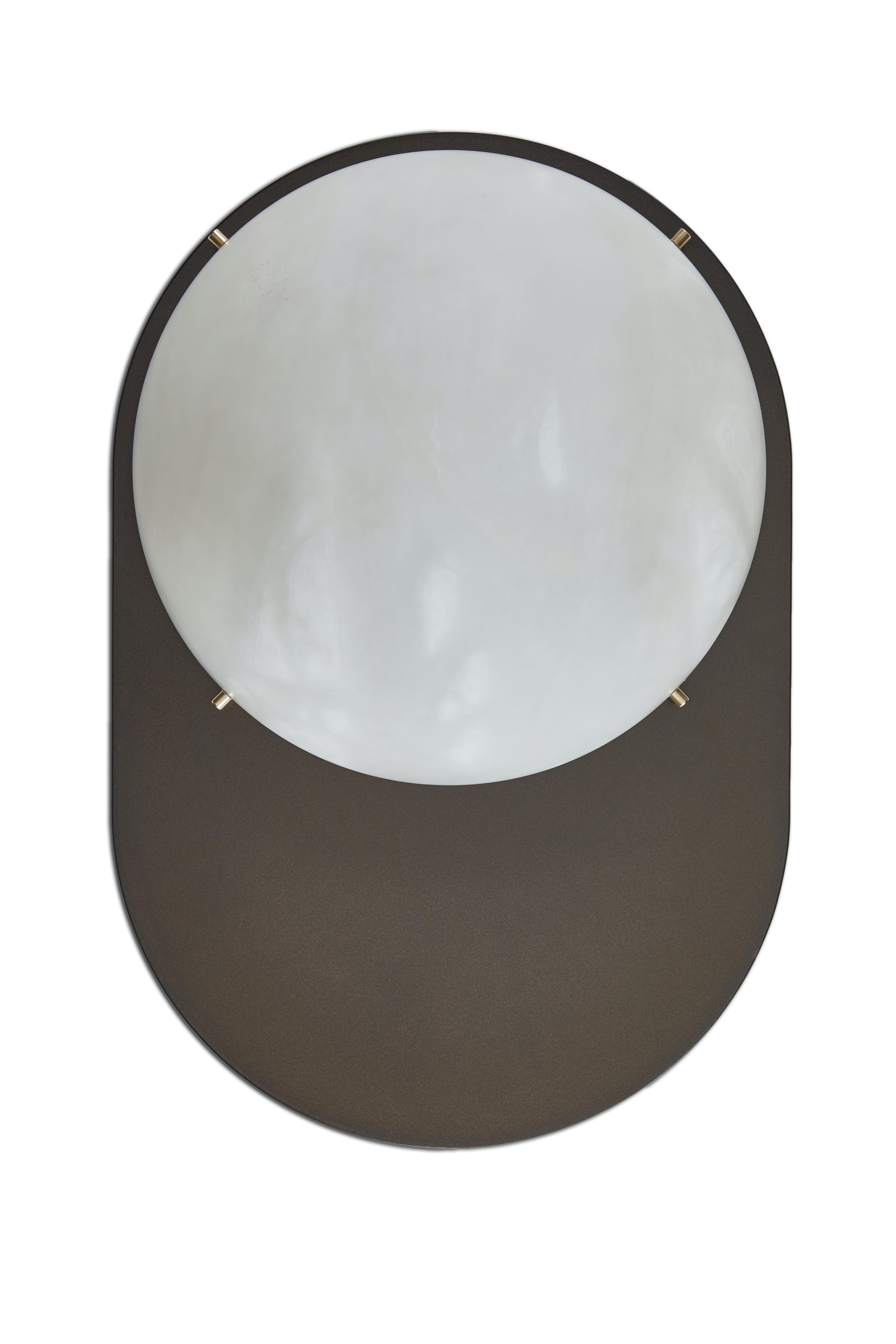 Large 'Toogle' sconce in bronzed steel and alabaster. Handcrafted in Los Angeles in the workshop of noted French designer and antiques dealer Denis de le Mesiere, who fabricates his highly refined original designs with scrupulous attention to detail