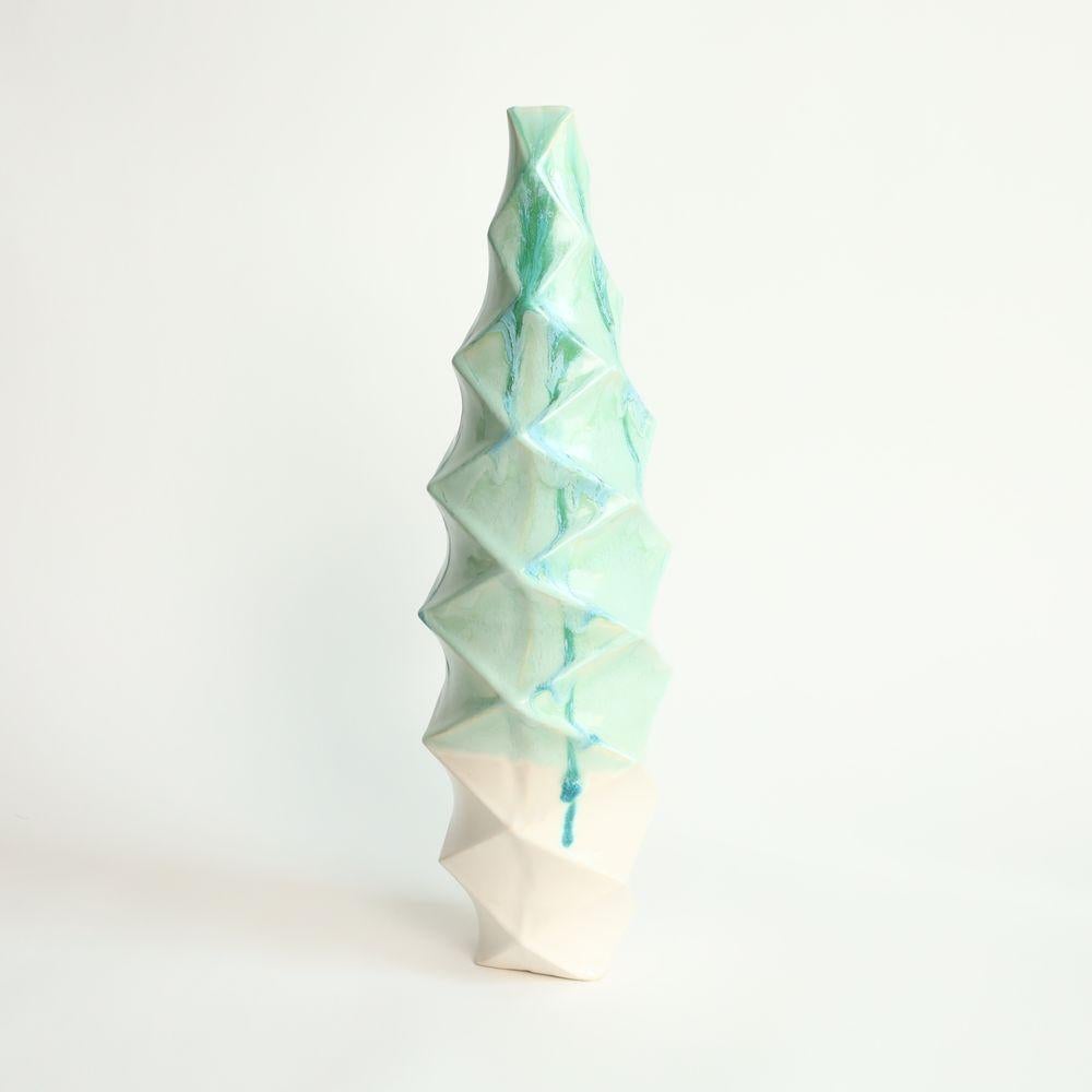 Large Tower in Jade
The Large Tower is a stunning piece of contemporary art that exudes an air of sophistication and elegance. Its towering form, which rises up to an impressive height, commands attention and inspires awe.
One of the most striking