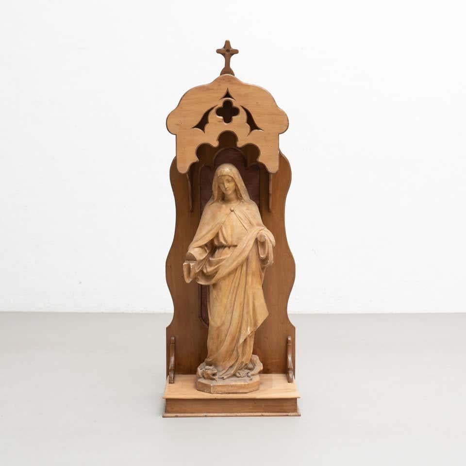 Traditional religious plaster figure of a virgin in a wooden niche.

Made in traditional Catalan atelier in Olot, Spain, circa 1950.

In original condition, with minor wear consistent with age and use, preserving a beautiful