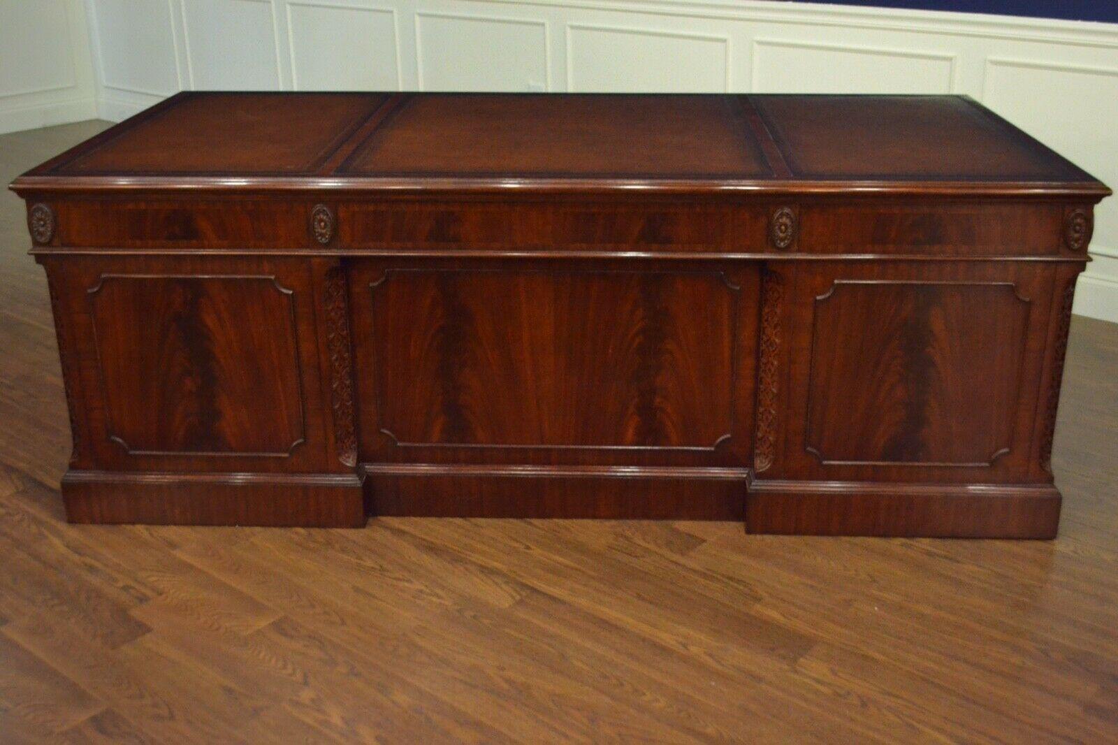 This is a new traditional mahogany executive desk. Its design was inspired by large desks from the 1800s. It is the larger version of our classic LH-3072. It is ideal for the senior partner or CEO. It features a top of brown leather with gold