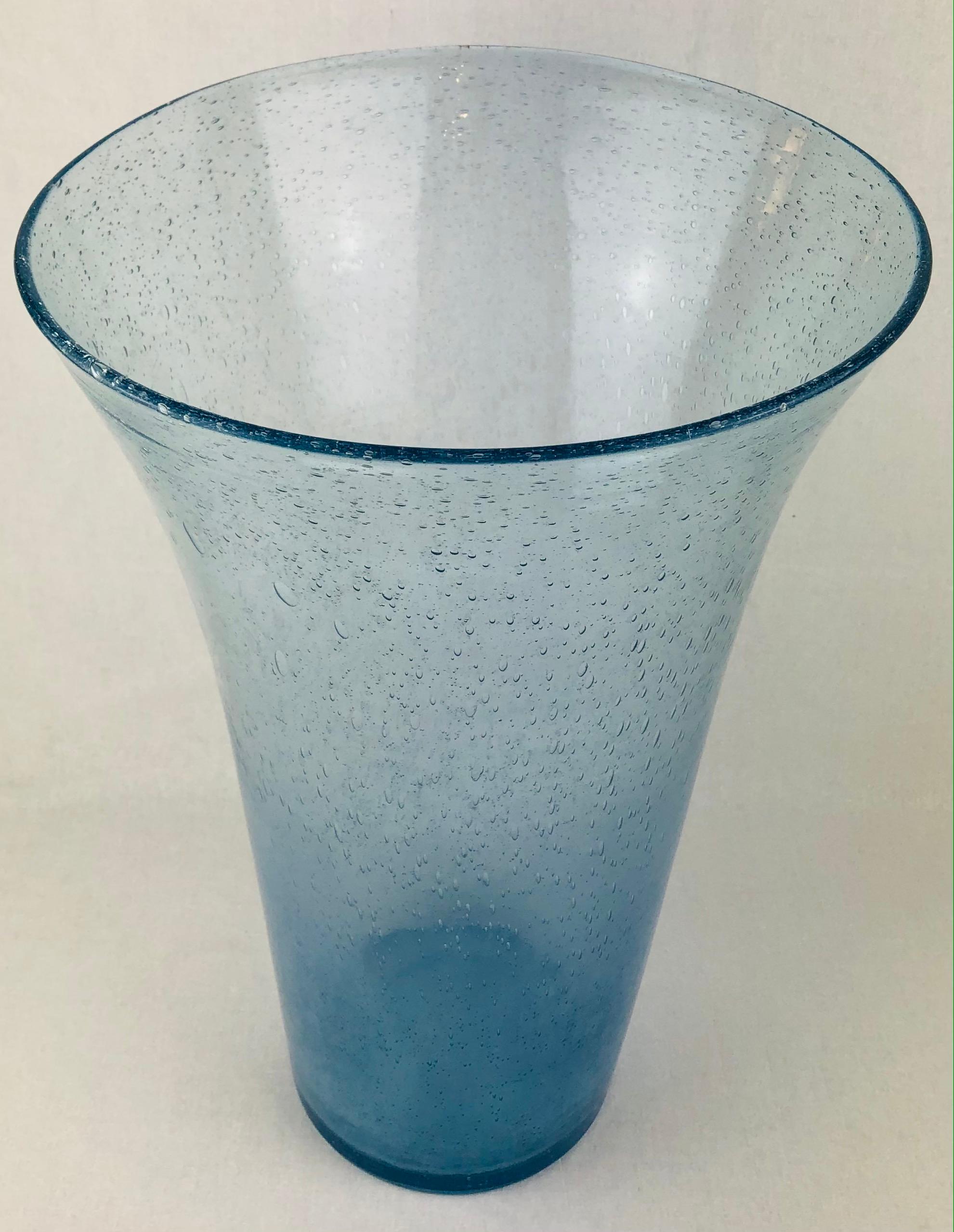 Large Murano art glass art glass vase in a beautiful translucent blue. 
Hand-blown with bubble inclusions.

Very good vintage condition, some minor traces of mineral deposits. 
Slight irregularity on the top rim, not perfectly round.

Measures: 18