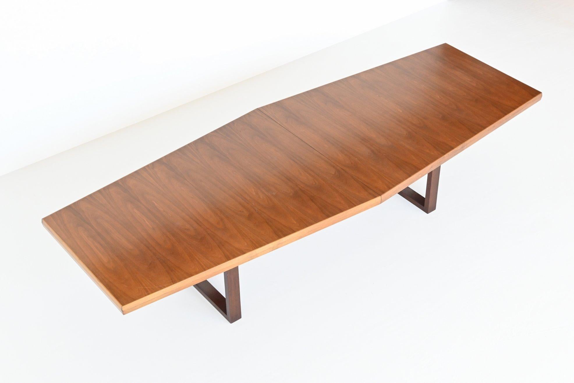 Beautiful trapezium shaped large conference or dining table, The Netherlands 1970. This very nice and unique table has a large tapered top made of veneered walnut wood. The top consists of two parts with a length of 320 cm and a width of 90 to 120