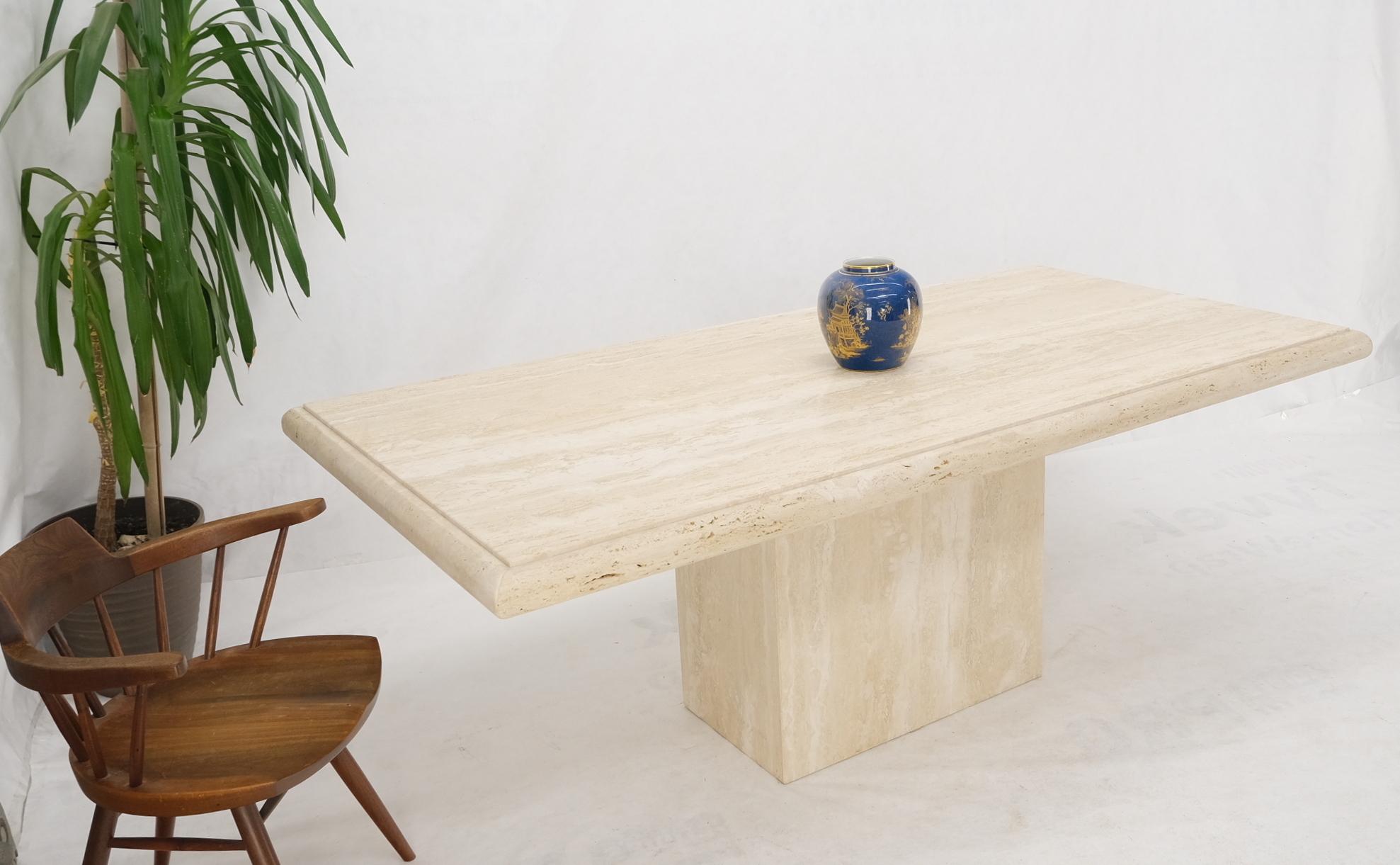 Large Italian travertine beveled edge single pedestal rectangle dining conference table.