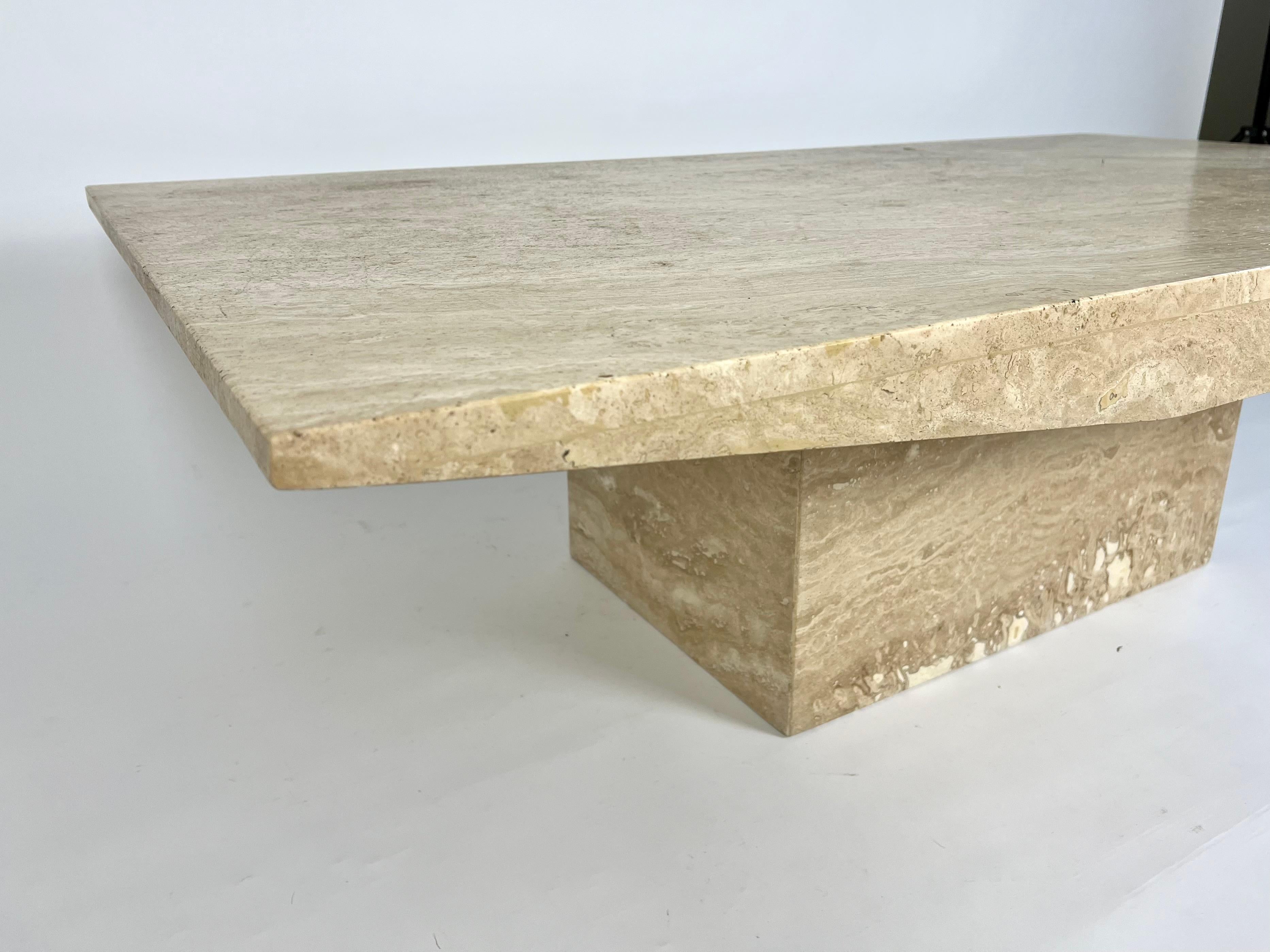 Large travertine stone coffee table, nice simplistic design

Natural, mid tone semi matt finish.

Excellent condition, no chips, cracks or stains. 

Top and base separate pieces. Very heavy!

For UK mainland delivery by courier, please message for a