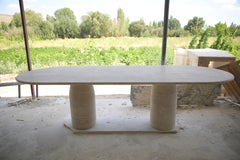 Large Travertine Oval Dining Table with Bullet Shape Legs by MY HABITAT DESIGN
