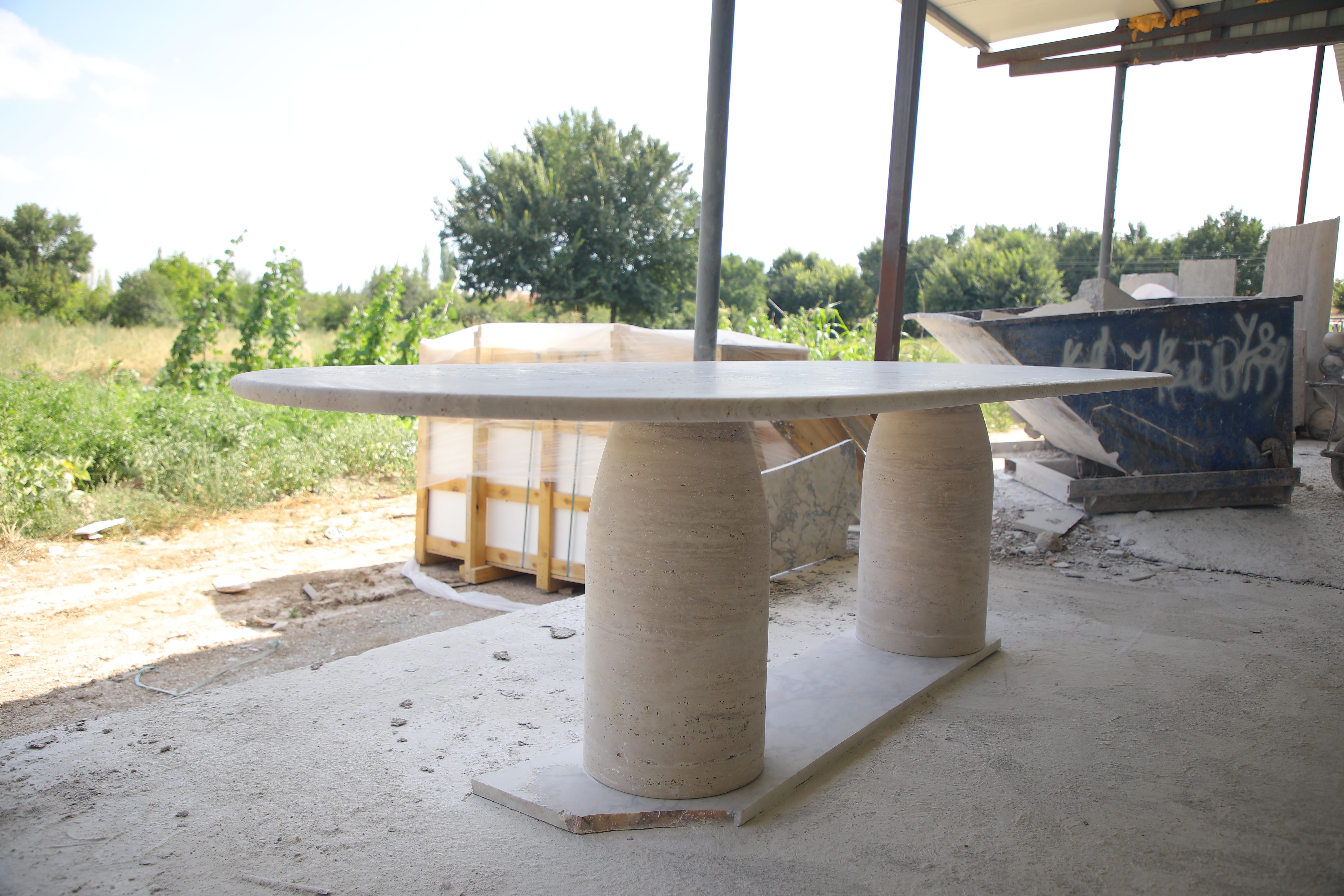 Large Travertine Oval Dining Table with Bullet Shape Legs by MY HABITAT DESIGN In New Condition For Sale In AMSTERDAM, NL