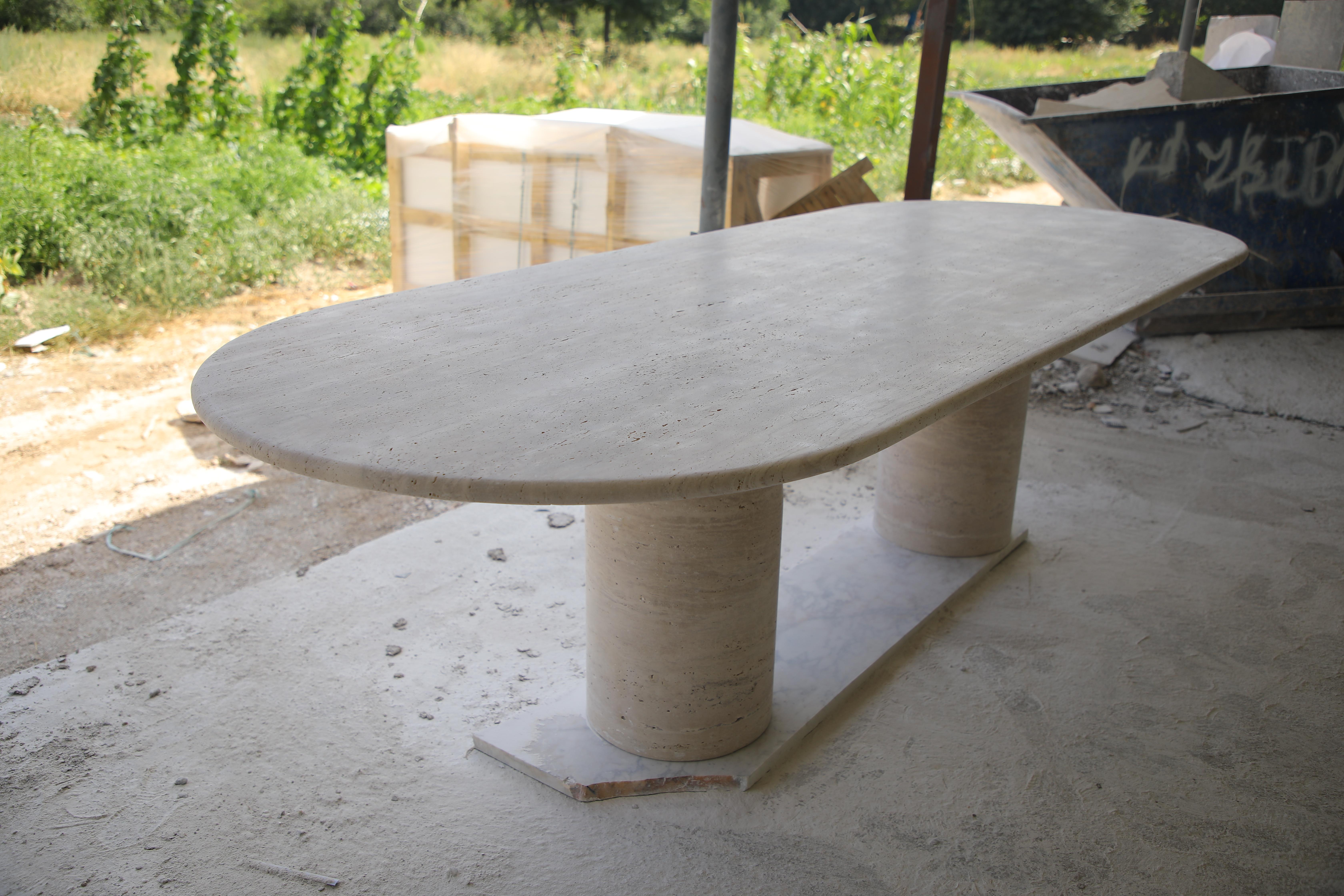 Contemporary Large Travertine Oval Dining Table with Bullet Shape Legs by MY HABITAT DESIGN For Sale