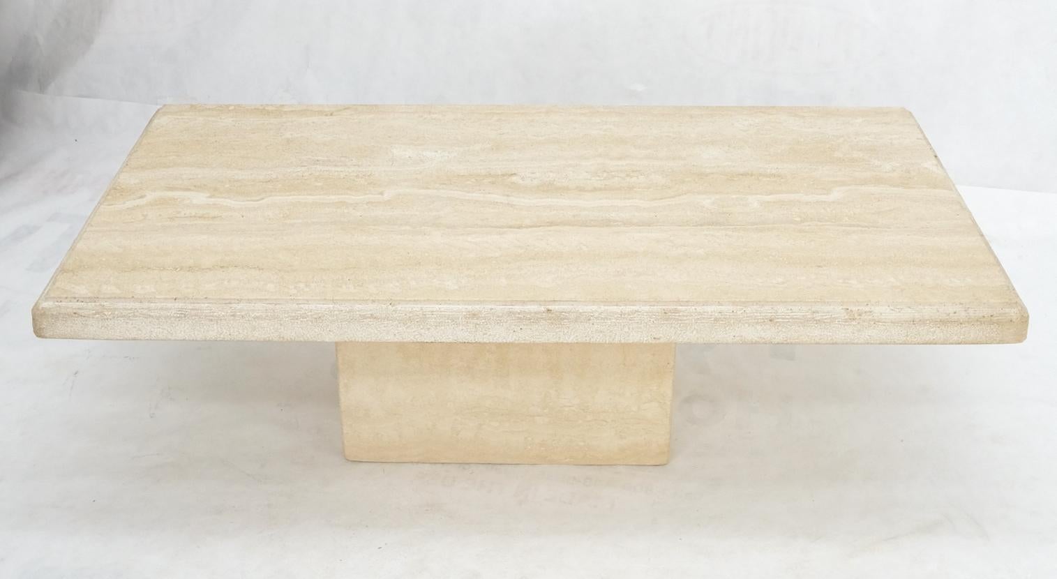 Large Italian Mid-Century Modern rectangle travertine single base coffee table. Made in Italy.