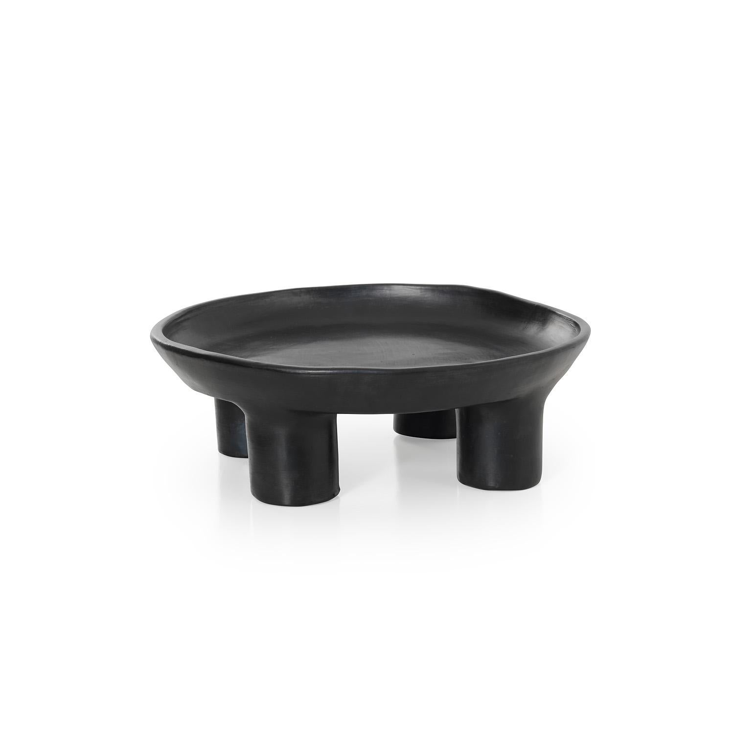 Large tray 1 by Sebastian Herkner
Materials: Heat-resistant black ceramic. 
Technique: Glazed. Oven cooked and polished with semi-precious stones. 
Dimensions: Diameter 44 cm x height 15 cm 
Available in sizes mini and small.

This pot belongs