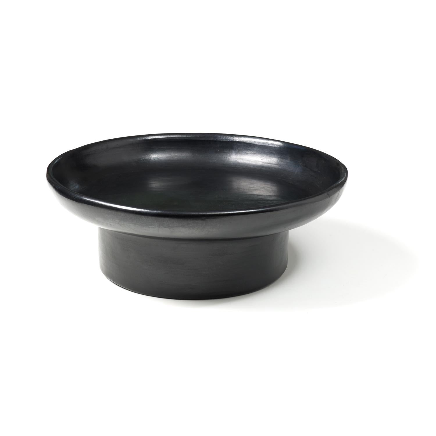 Large tray 2 by Sebastian Herkner
Materials: Heat-resistant black ceramic. 
Technique: Glazed. Oven cooked and polished with semi-precious stones. 
Dimensions: Diameter 44 cm x H 15 cm 
Available in sizes Small and Mini.

This pot belongs to