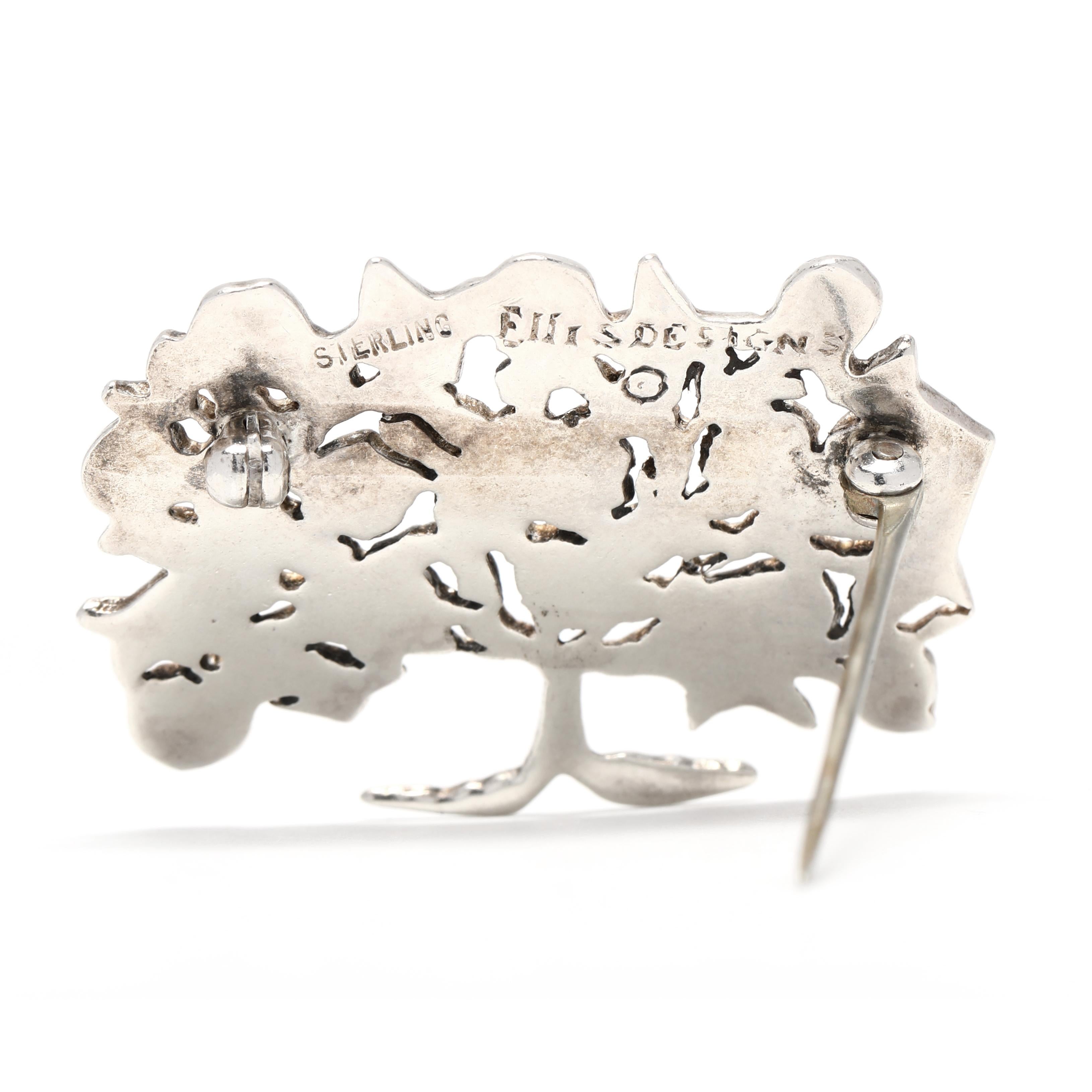 This beautiful tree of life brooch is made from sterling silver and measures 1 inch in length. The flat engraved design features a tree with intricate branches that is sure to be admired. This brooch is perfect to wear on any outfit and will add a