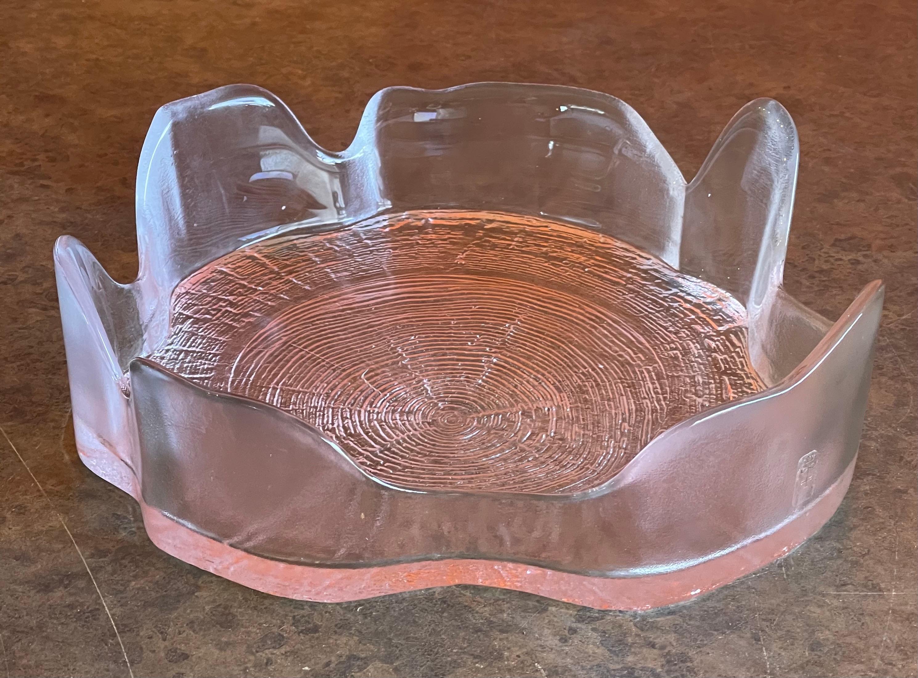 A large tree trunk crystal bowl by Bengt Edenfalk for Skruf of Sweden, circa 1970s. This a lovely shallow crystal bowl in the form of a hollow tree trunk; the base showing a cross section of the growth rings with a fine undulating rim. The piece is