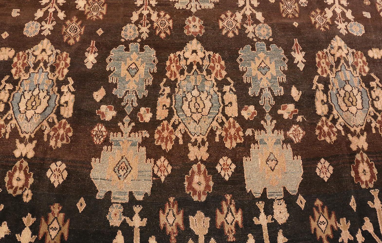 Large impressive tribal design room size antique Persian Malayer rug, country of origin / rug type: Persian rugs, date: circa late 19th century. Size: 10 ft 7 in x 15 ft 7 in (3.23 m x 4.75 m). Through the use of skillful contrast and elegantly