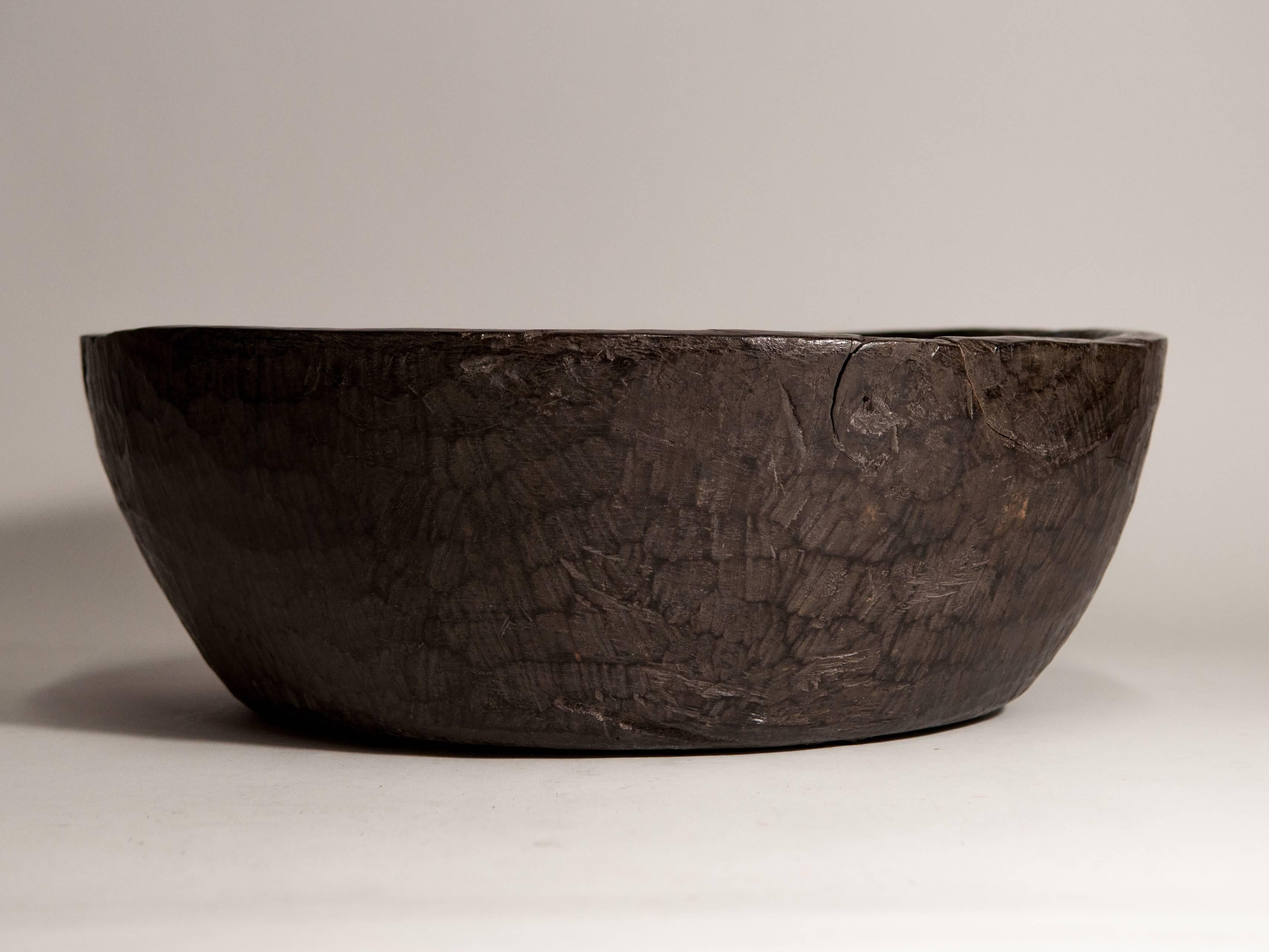 Large tribal ironwood bowl from the Dayak of Borneo, mid-20th century.
This bowl is hand hewn from a single piece of very dense ironwood; beautiful in its simplicity.
Dimensions: 18 inch diameter by 6.5 inches tall.