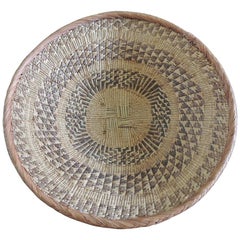 Vintage Large Tribal Round Woven Basket in Natural and Brown with Braided Rim