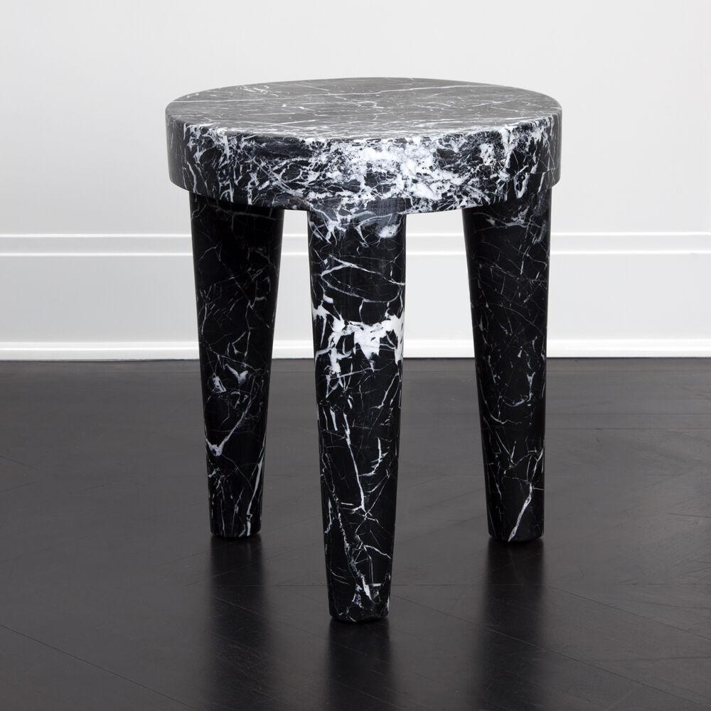 Carved out of a solid block of marble, this stool is a perfect example of a Classic, modern shape that is effortlessly stylish. Great as either a stool or small table, the tribute stool is available in black Nero Marquina, white Calcutta, big flower
