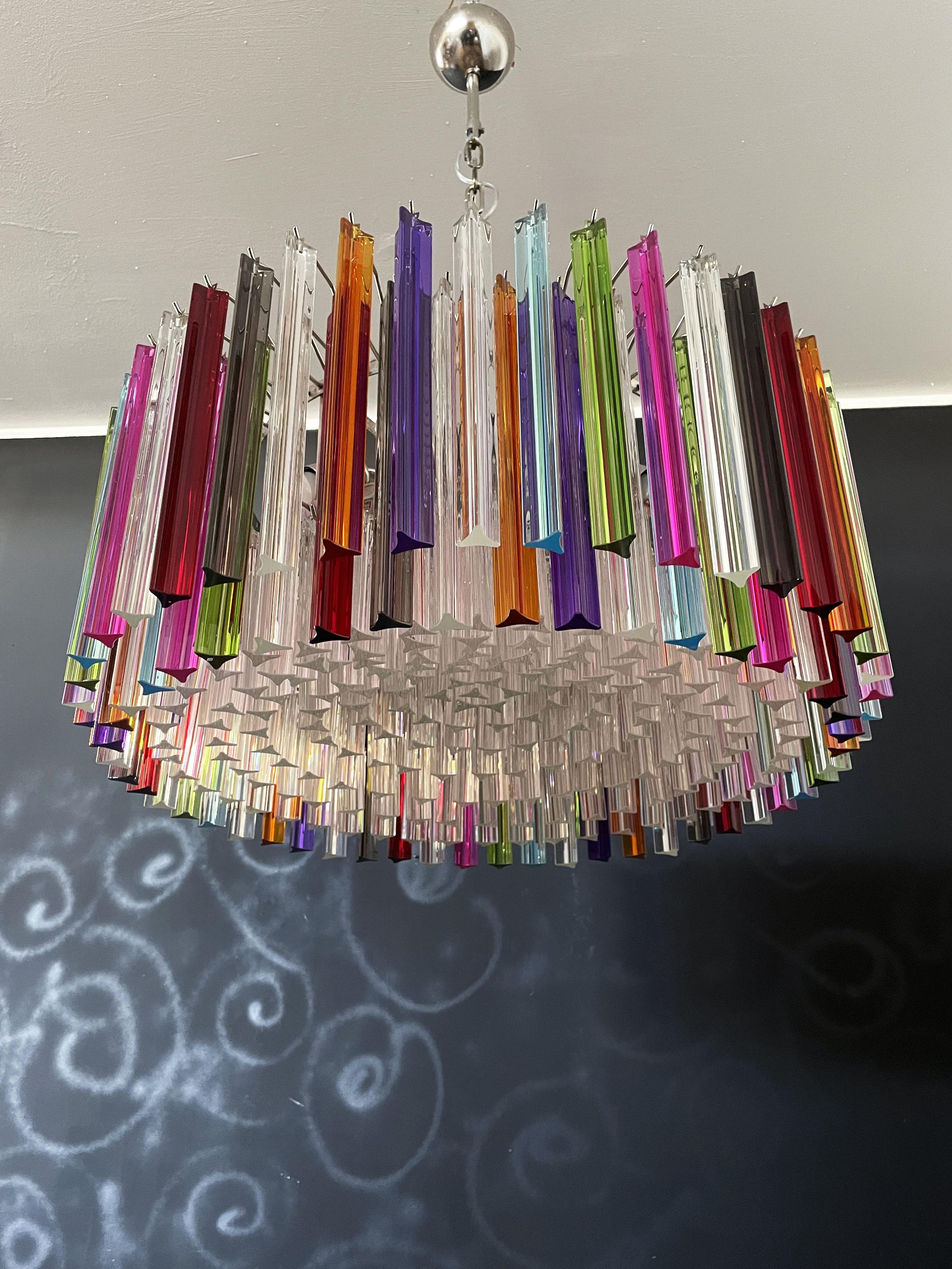 A magnificent Murano glass chandelier, 265 multicolored and clear triedri on crome frame. This large Mid-Century Italian chandelier is truly a timeless classic.
Period: late XX century
Dimensions: 43,30 inches (110 cm) height with chain; 15,75