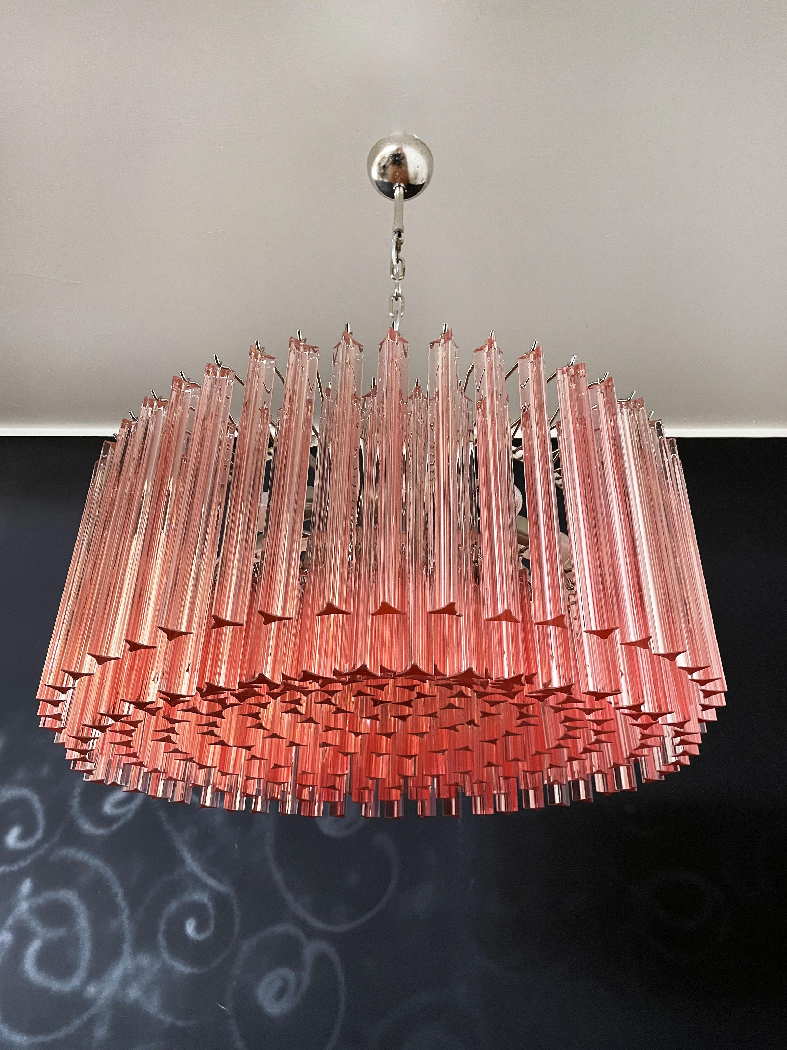 A magnificent Murano glass chandelier, 265 pink triedri on crome frame. This large Mid-Century Italian chandelier is truly a timeless classic.
Period: late XX century
Dimensions: 43,30 inches (110 cm) height with chain; 15,75 inches (40 cm) height