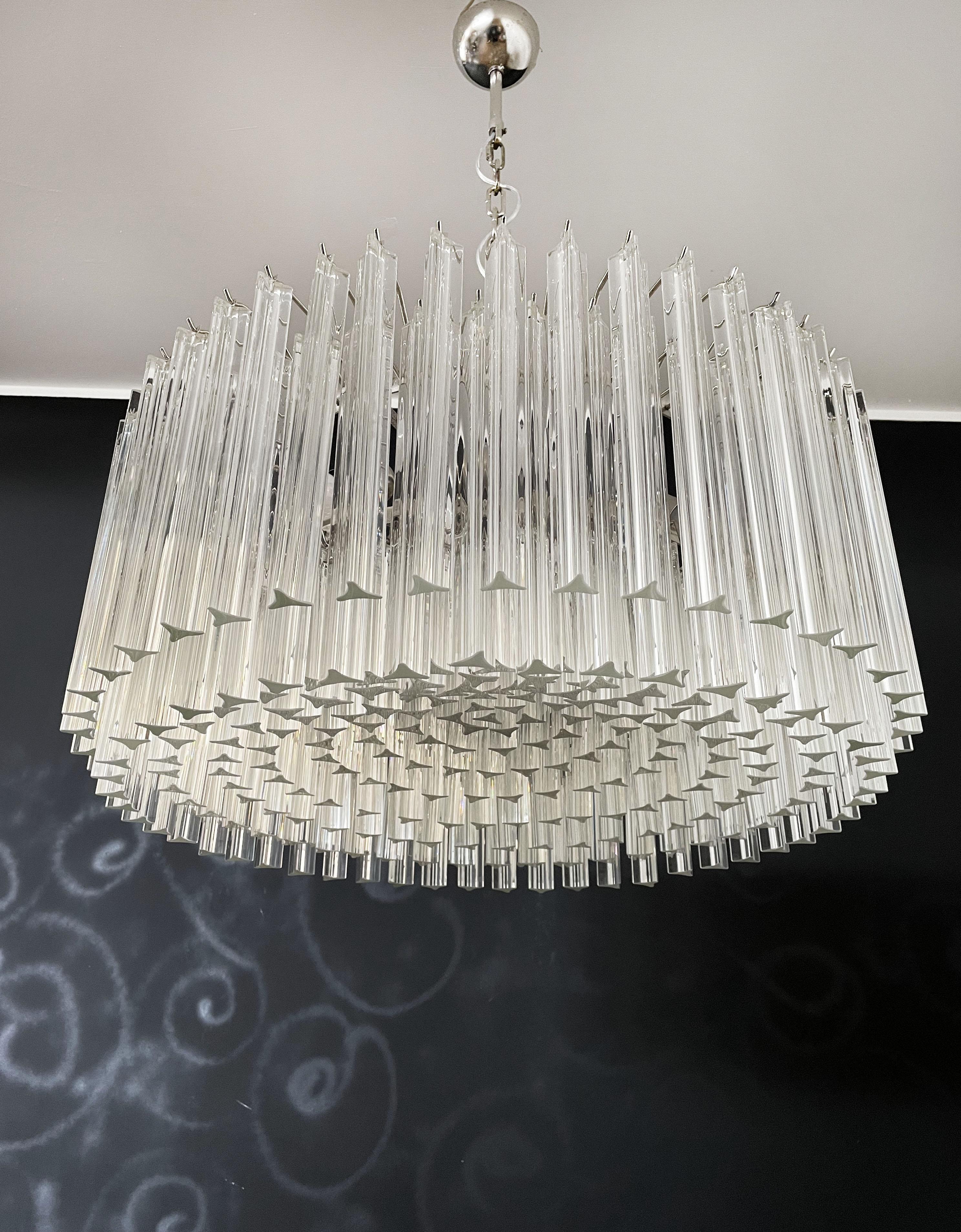 A magnificent Murano glass chandelier, 265 triedri on crome frame. This large Mid-Century Italian chandelier is truly a timeless classic.
Period: late XX century
Dimensions: 43,30 inches (110 cm) height with chain; 15,75 inches (40 cm) height
