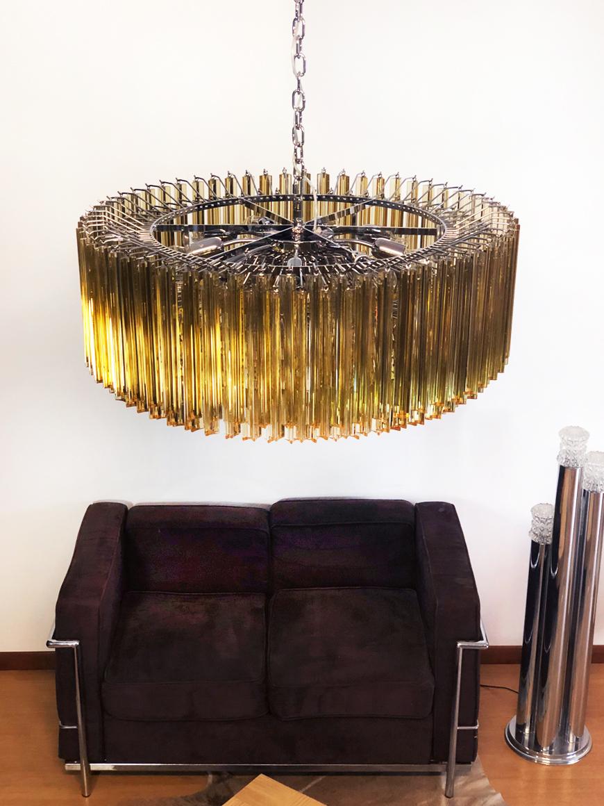 A magnificent Murano glass chandelier, 391 triedri clear amber on crome frame. This large Mid-Century Italian chandelier is truly a timeless classic.
Period: late XX century
Dimensions: 47,25 inches (120 cm) height with chain; 15,75 inches (40 cm)