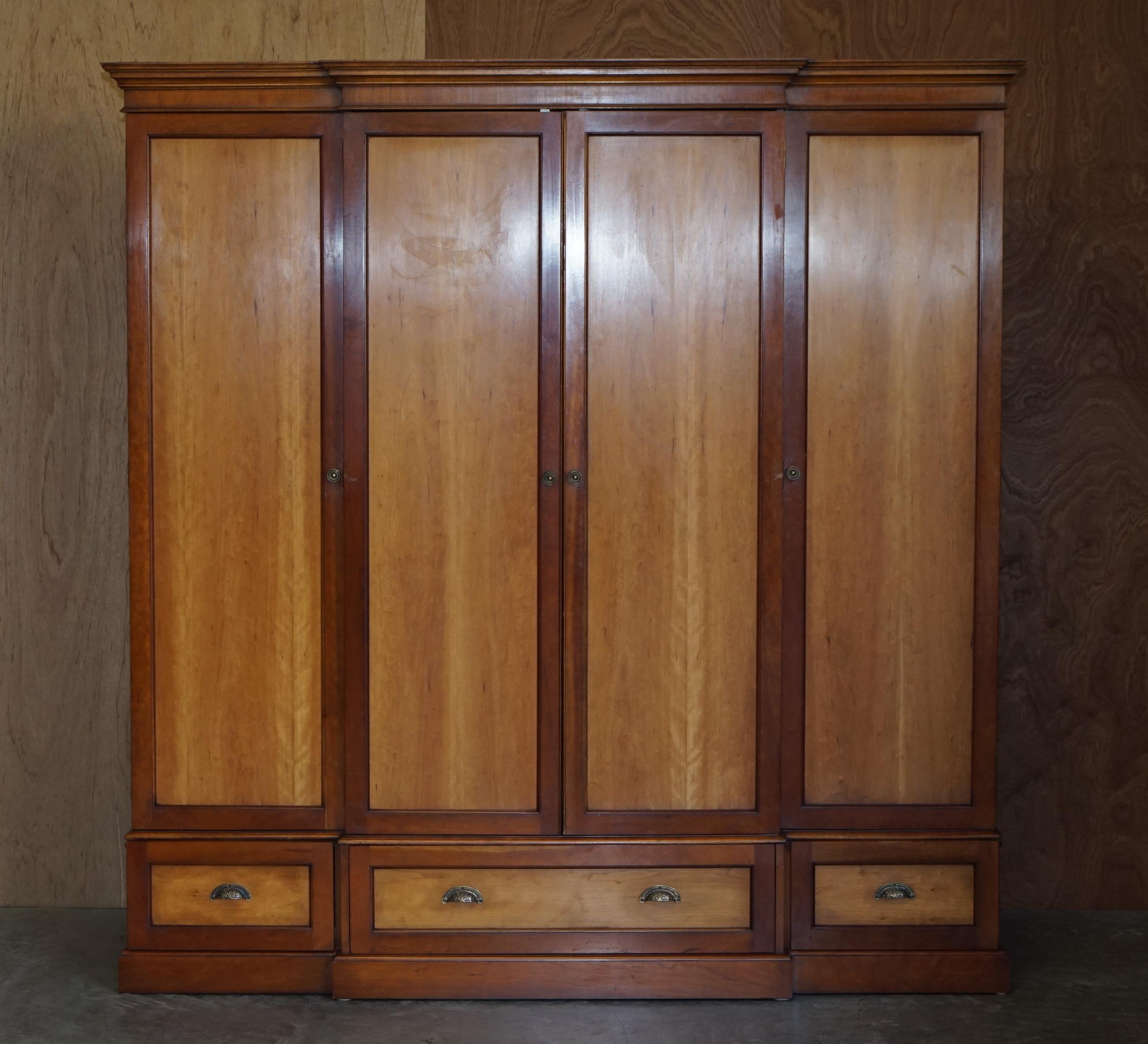 We are delighted to offer this lovely large Cherrywood and Walnut breakfront wardrobe with drawers to the base

Please note the delivery fee listed is just a guide, it covers within the M25 only for the UK and local Europe only for