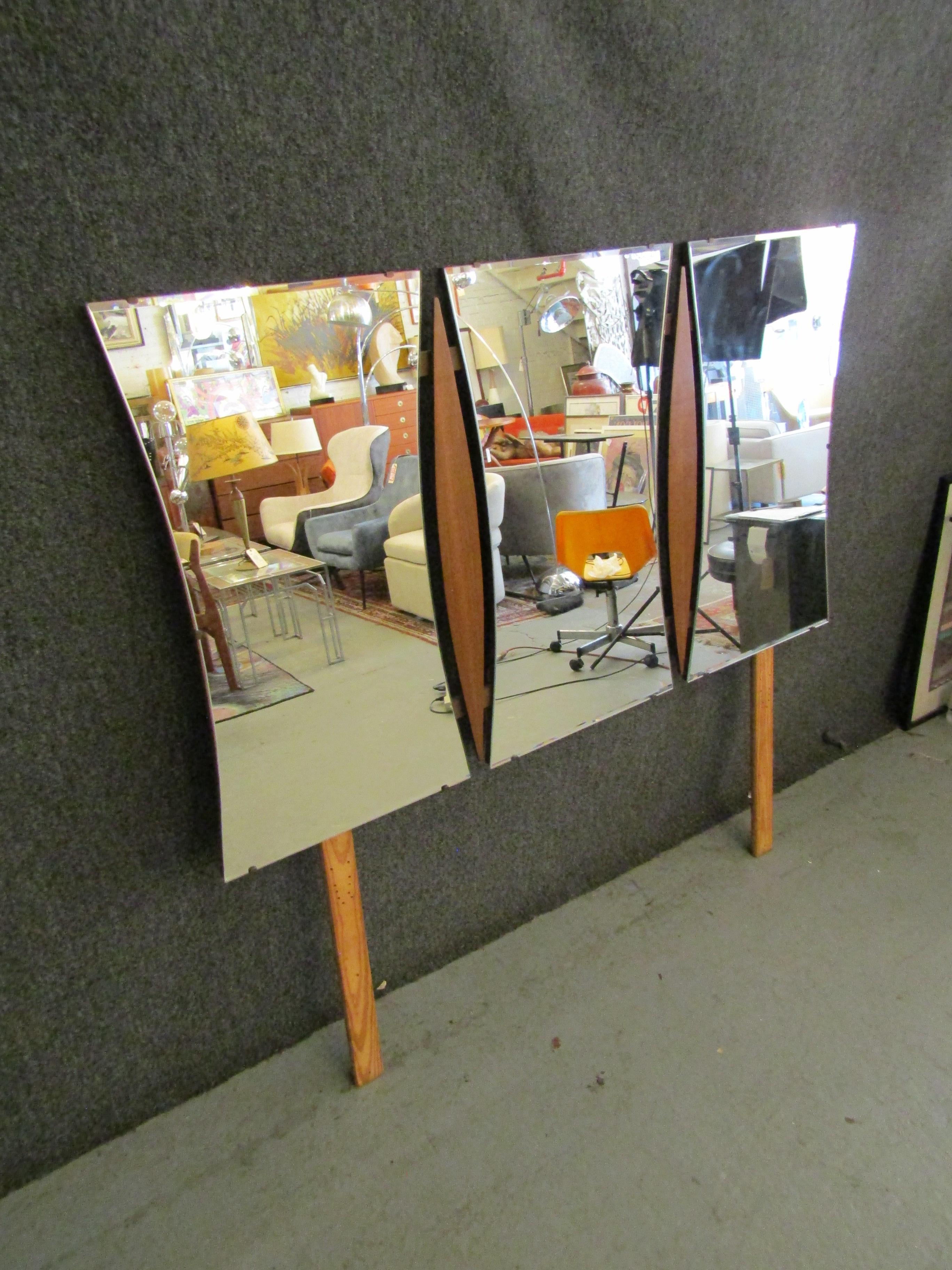 Mid-century modern wall mirror in three curved mirrors connected by sculpted walnut inserts. Back wood mounts can be removed to hang by wire.
Please confirm location NY or NJ