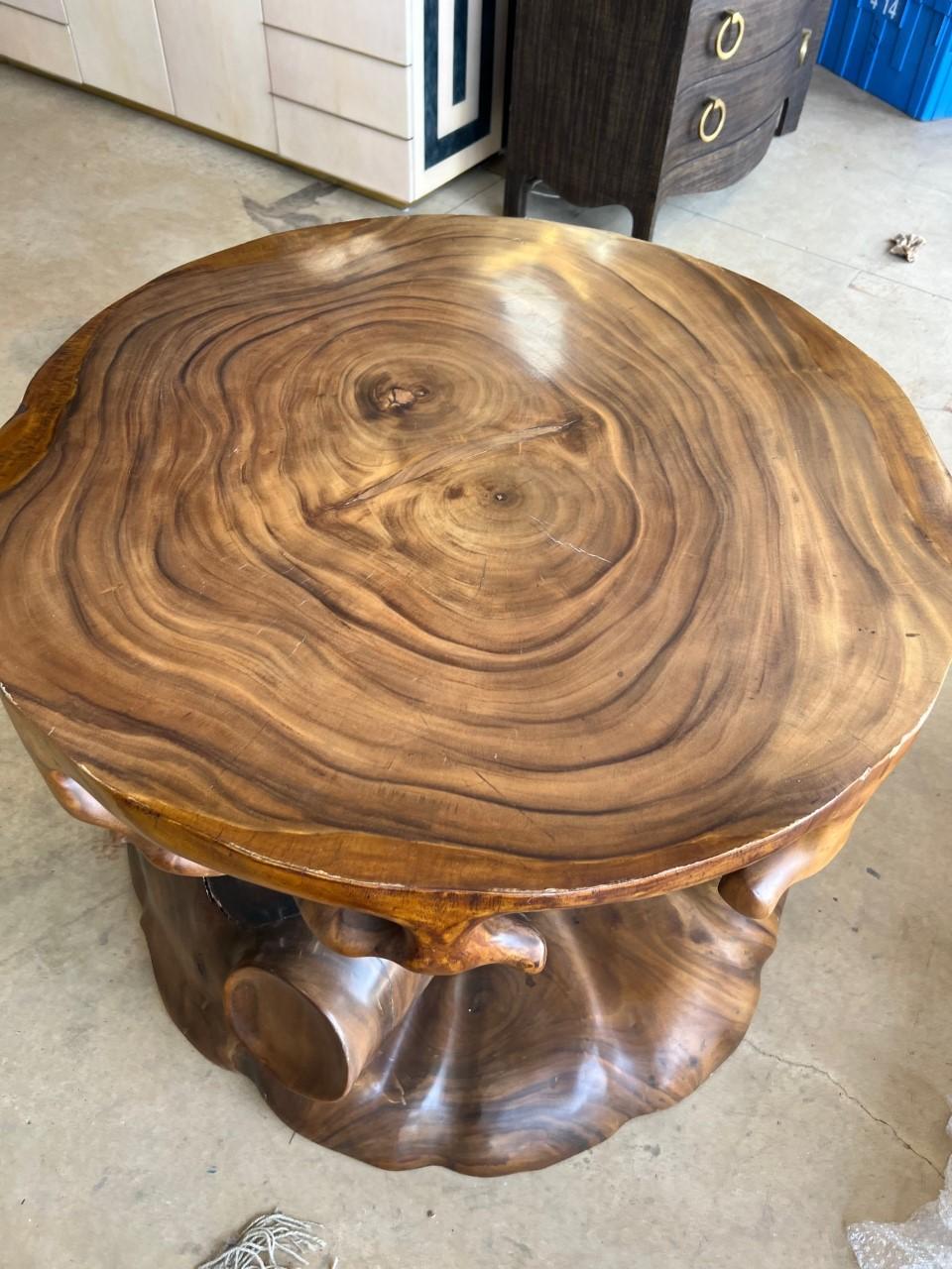 Large and heavy truffle solid wood trunk dining table base and can also be use as side table or pedestal.

A truffle trunk table is a luxury furniture piece made of hand-carved solid wood trunk with a glossy finish light and dark walnut finish. It
