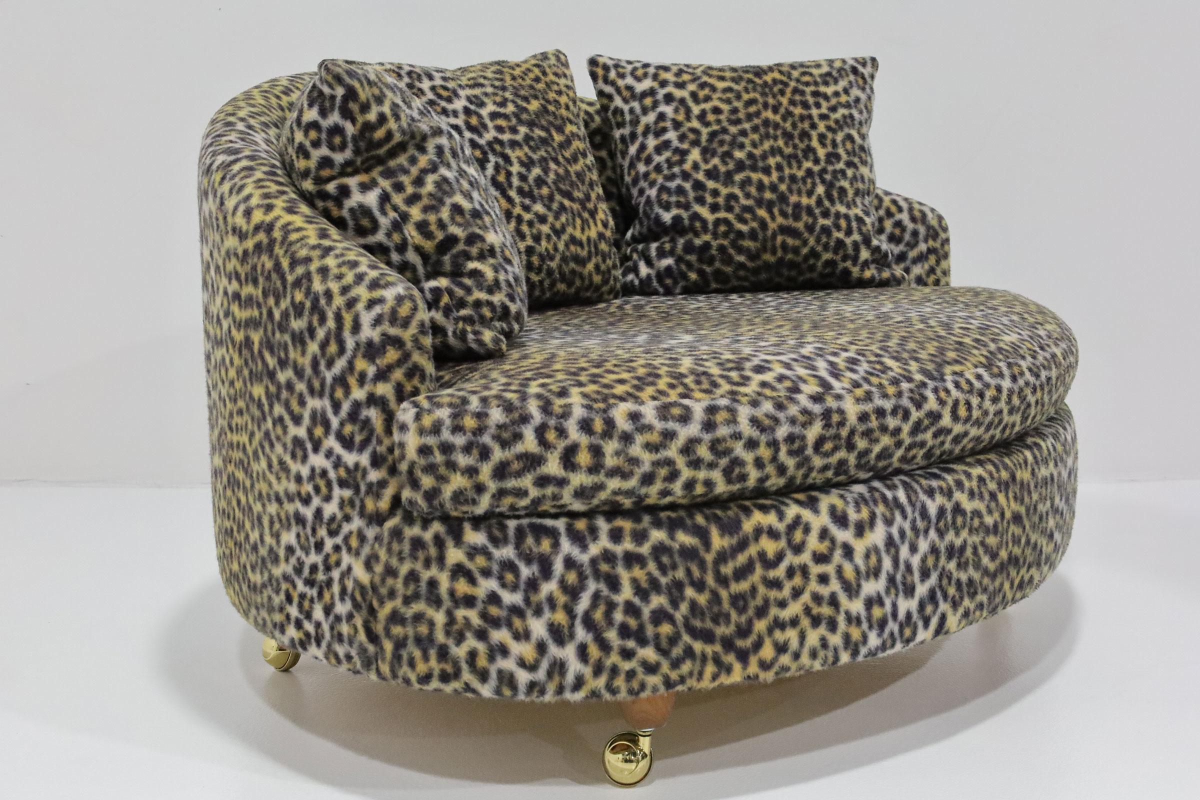 Experience unparalleled comfort and timeless style with our Large Tub Chair in the style of Adrian Pearsall. This very comfortable oversized tub chair, set on small wooden legs with casters attached, brings both elegance and functionality to any mid
