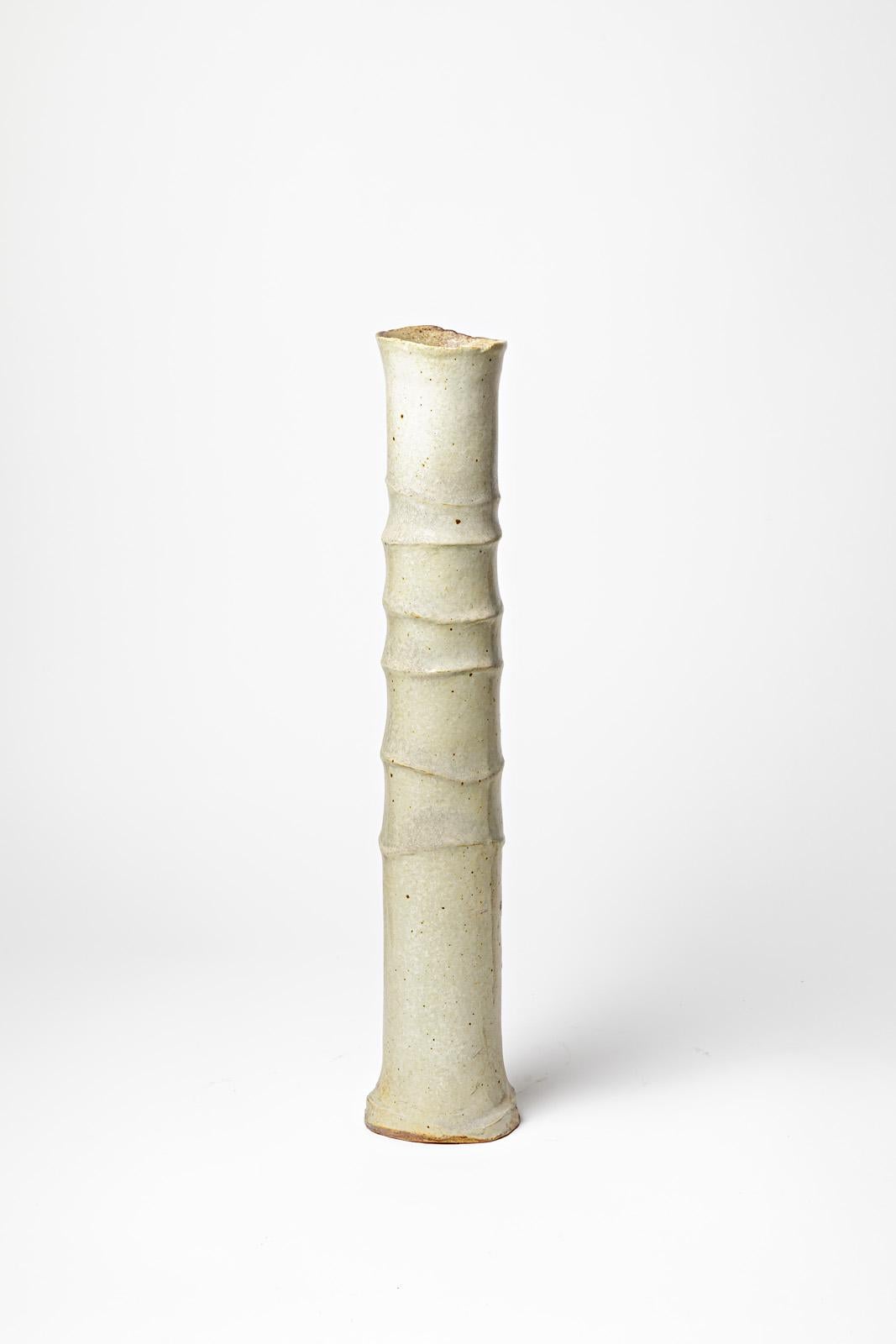 Large tubular vase « Bambou » in white glazed stoneware by Jean-Pierre Bonardot.
Artist monogram under the base. Unique piece, circa 1990.
H : 17.7’ x 3.1’ inches.
