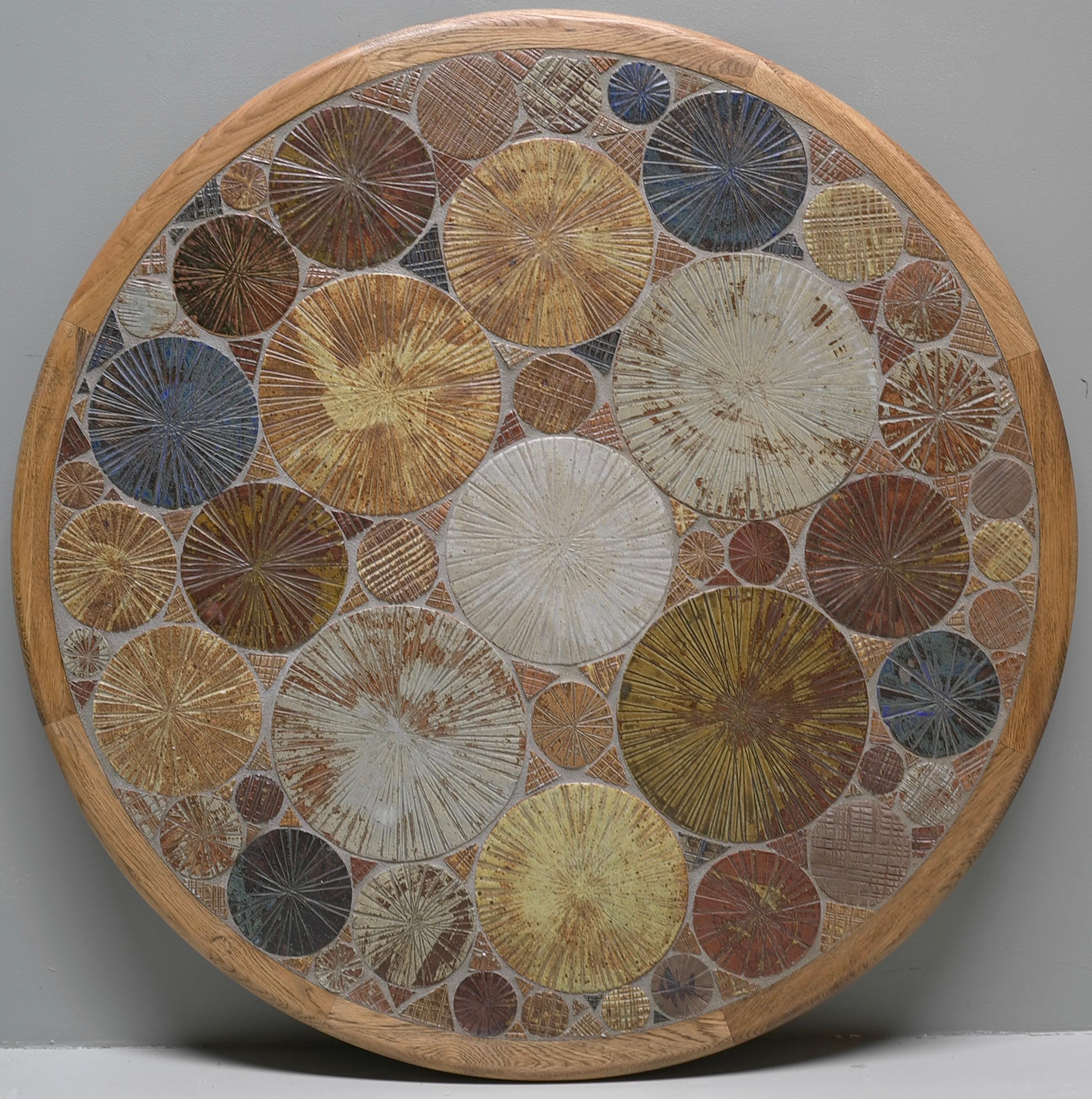 Large Tue Poulsen round Ceramic and Oak coffee table
Haslev Møbelsnedkeri A/S, Denmark, 1963
Multi-color textured tiles were handmade by the Danish artist.
Signed by the artist Tue.