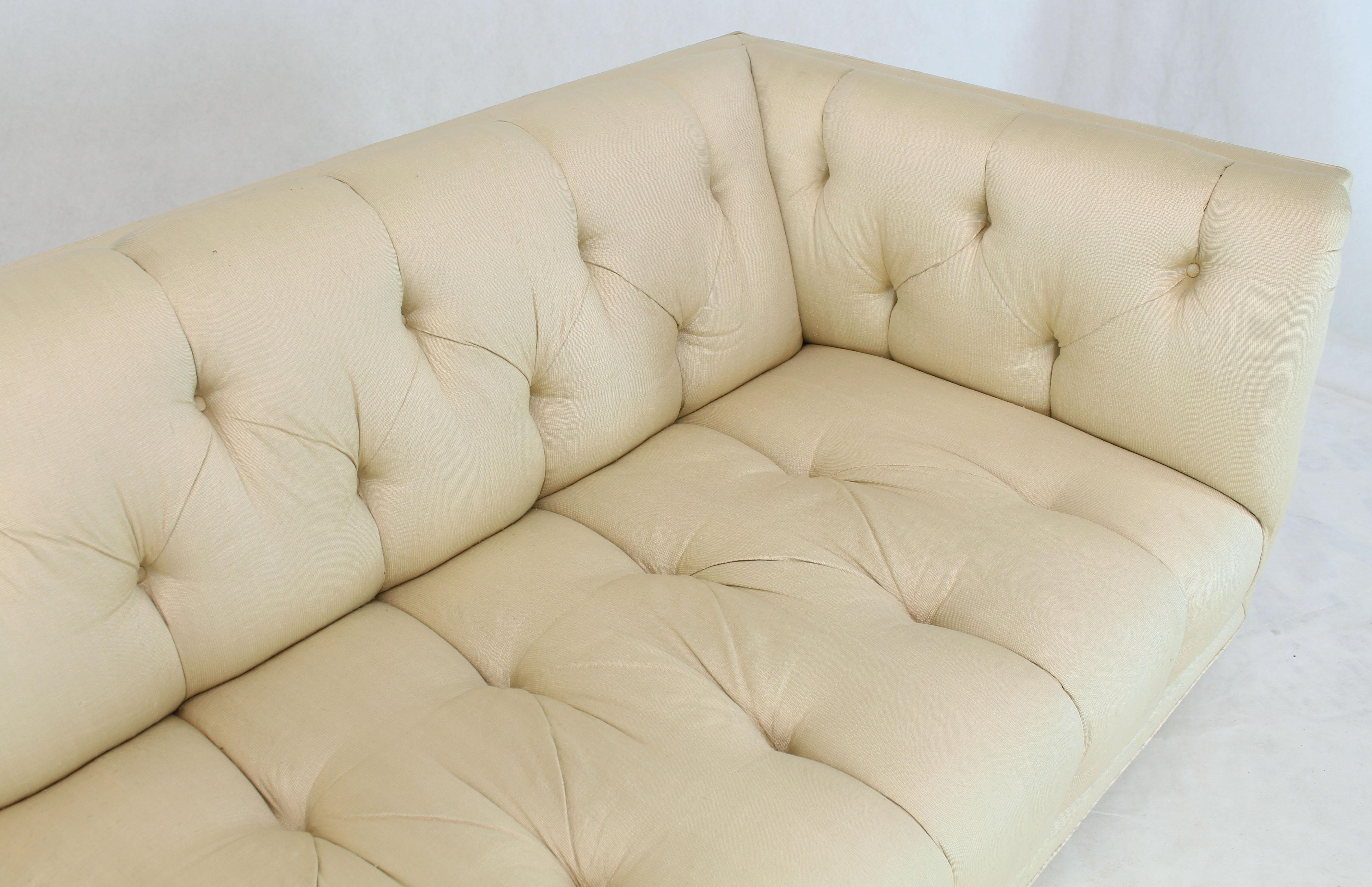 Boxed tufted silk like upholstery Mid-Century Modern sofa with four matching pillows.