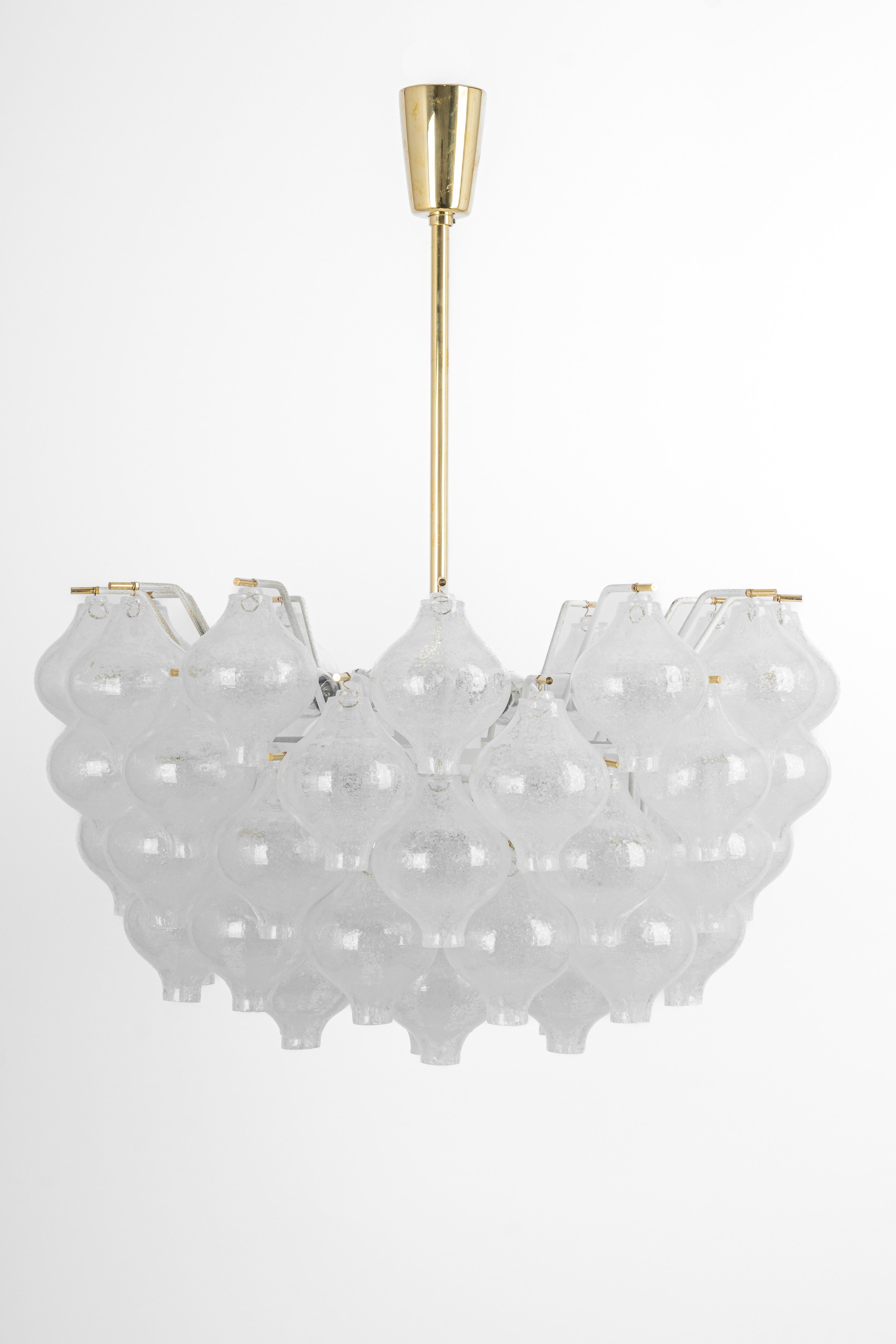 Wonderful onion shaped -Tulipan glass chandelier. Many hand blown glasses suspended on white painted metal frame and brass center rod.
Best of design from the 1960s by Kalmar, Austria. High quality of the materials.

Sockets: 12 x E14/ or E12