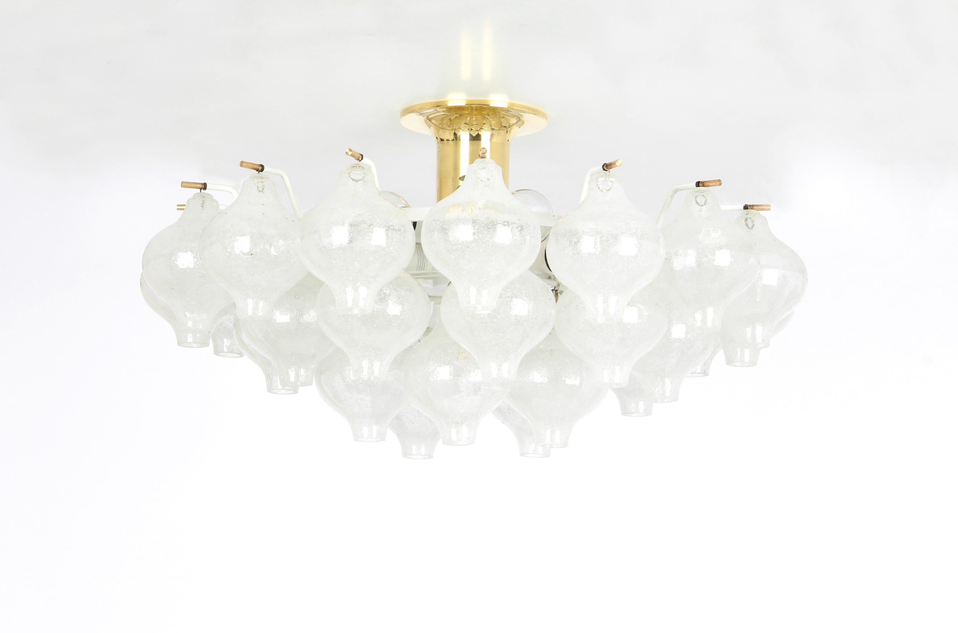 Wonderful onion-shaped -Tulipan glass chandelier. 30 hand blown glasses suspended on a white painted metal frame.
Best of design from the 1960s by Kalmar, Austria. High quality of the materials.

Sockets: The chandelier takes 9 small screw base