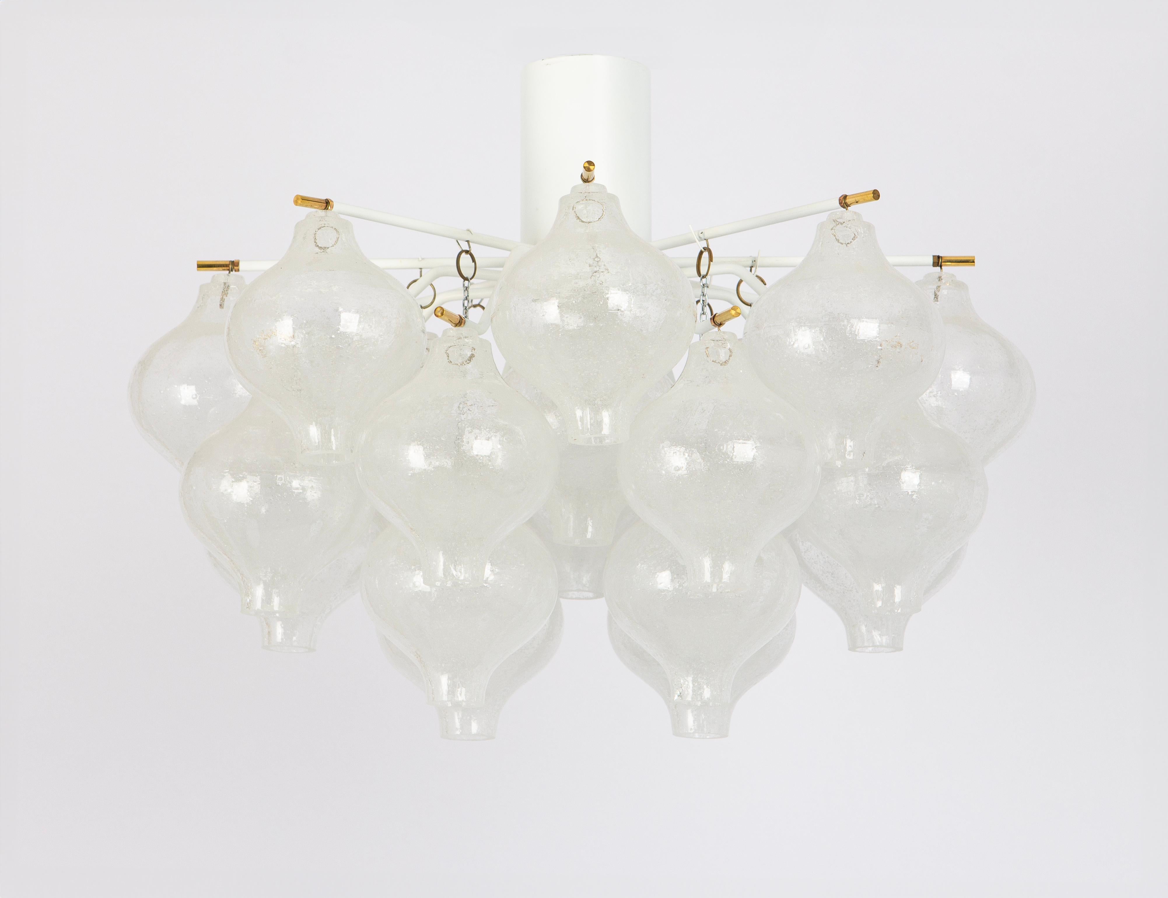 Wonderful onion-shaped -Tulipan glass Flush mount light. Twenty-four hand-blown glasses suspended on a white colored metal frame.
Best of design from the 1960s by Kalmar, Austria. High quality of the materials.
Beyond its practical function, the