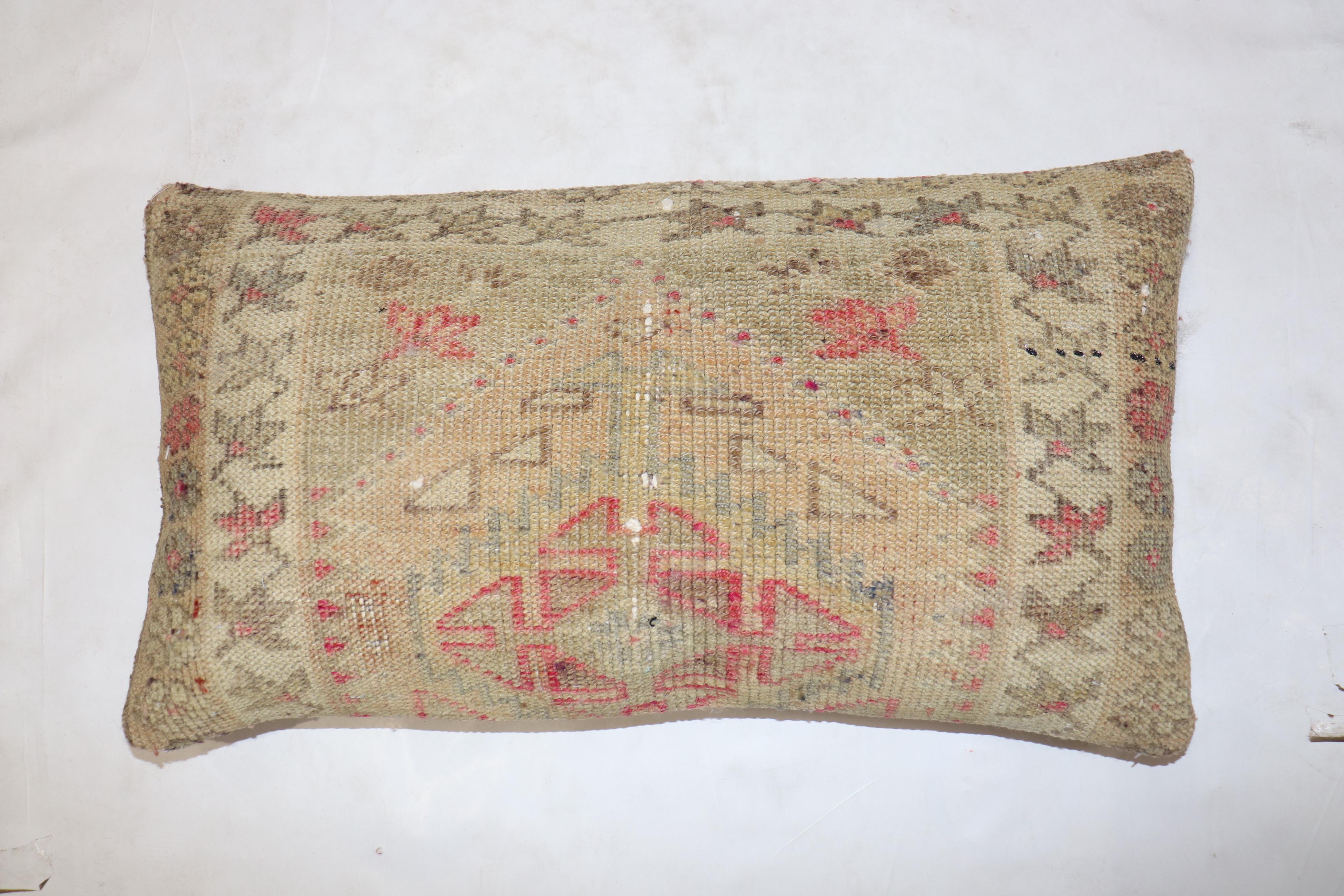 Pillow made from a mid-20th-century Turkish Anatolian rug in a bolster size. zipper closure and poly fill insert provided

Measures: 15'' x 27''.
