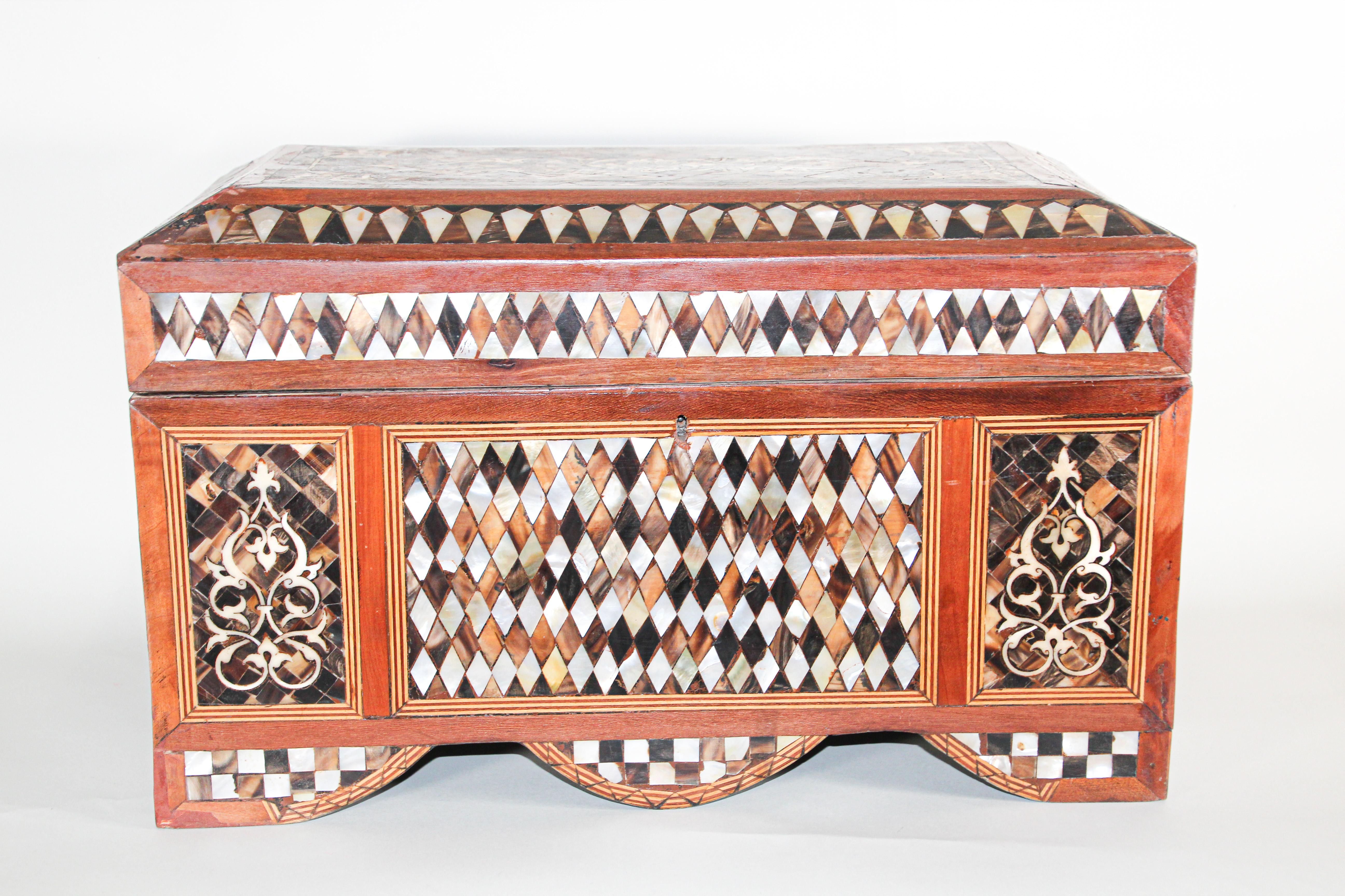 A rare large handcrafted Moorish jewelry wedding box with mother of pearl inlay.
A circa 1900 Turkish mother of pearl inlaid chest inlaid throughout to show foliate scrolls and geometric forms.
From the 16th century onwards the dominant influences
