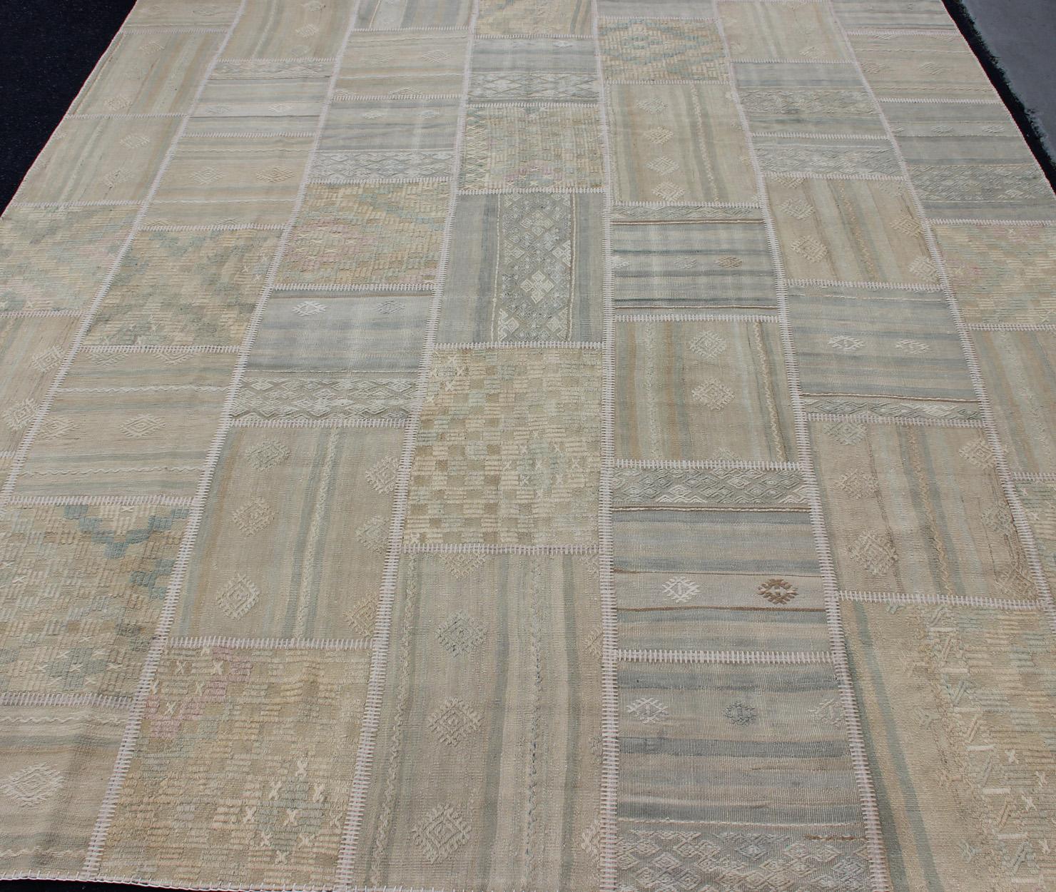 Large Turkish kilim from vintage pieces skillfully put together. This fine patchwork rug has light green, tan, taupe, blue, cream, brown and neutral tones, rug/EN-179675, country of origin / type: Turkey / Patchwork, circa 1930.

This vintage