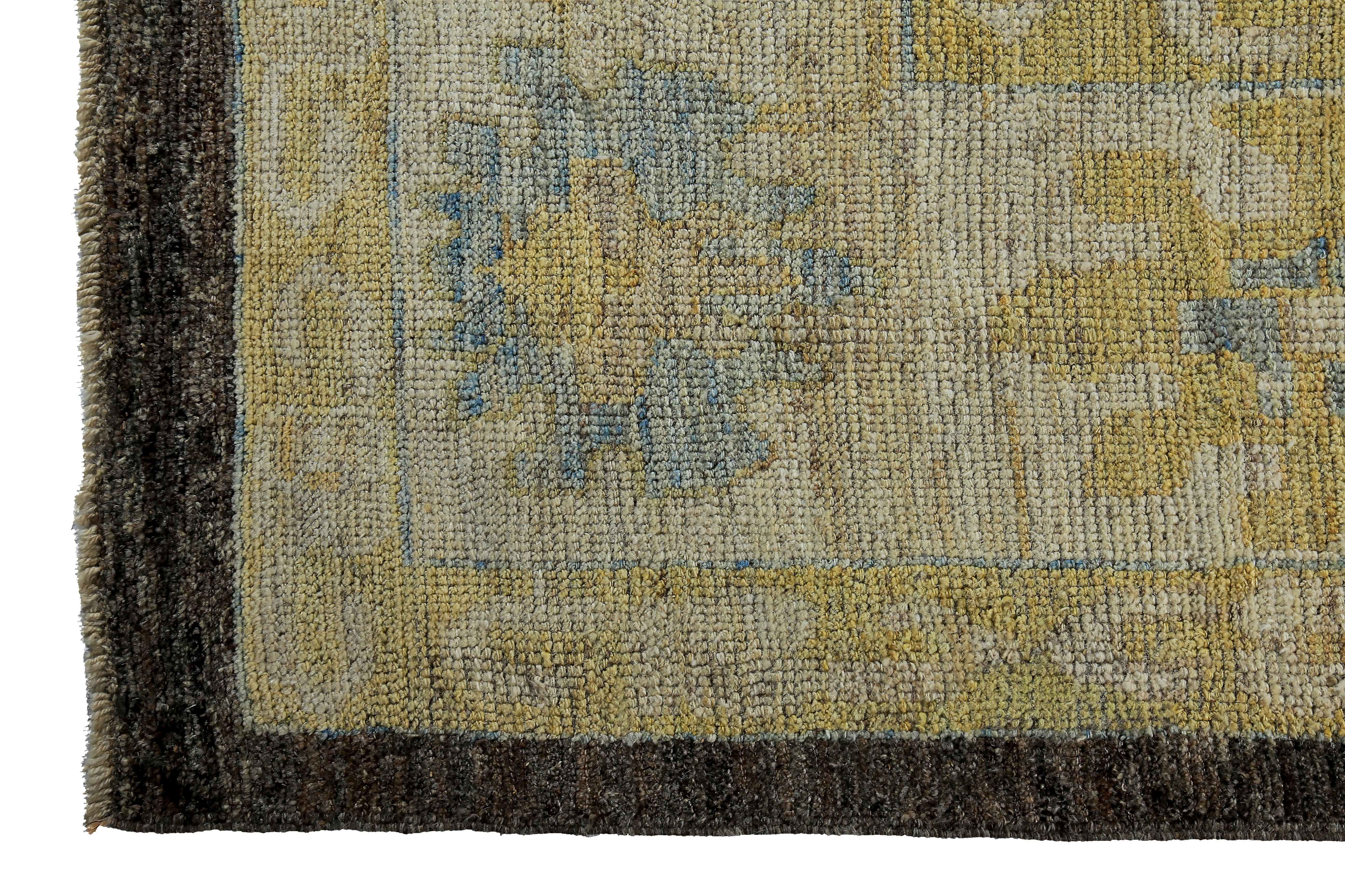 Wool Large Turkish Oushak Rug with Blue and Gold Floral Details on Brown Field For Sale