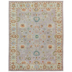 Alfombra turca Oushak de colores con diseño floral integral en lavanda y verde claro