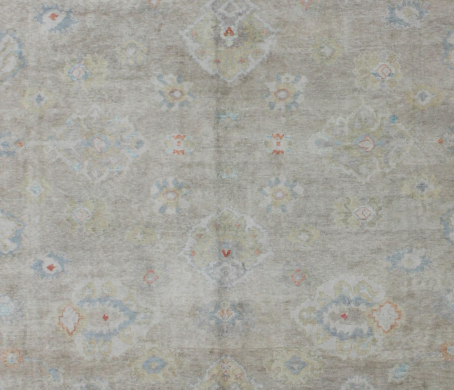 Hand-Knotted Large Turkish Oushak Rug with Neutral Color Palette and All-Over Flower Design For Sale