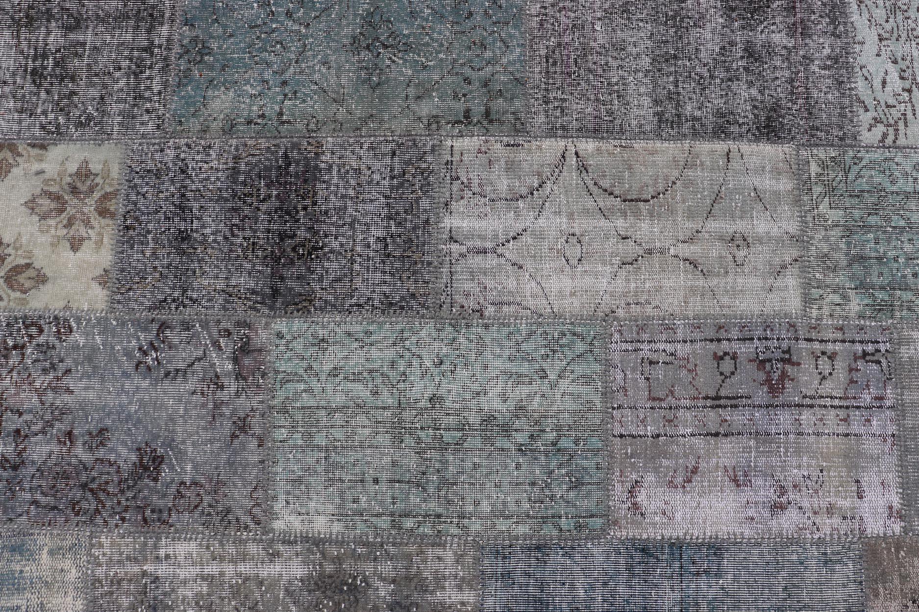 Large Turkish Patchwork Rug in Grey, Green, Blue, Brown and Neutral Tones. These rug TU-ERD-7669-TU-ERD-7671, country of origin / type: Turkey / Mid-Century Modern, circa Mid-20th century.
Measures: 13'4 x 20'4.
This vintage Turkish rug is composed
