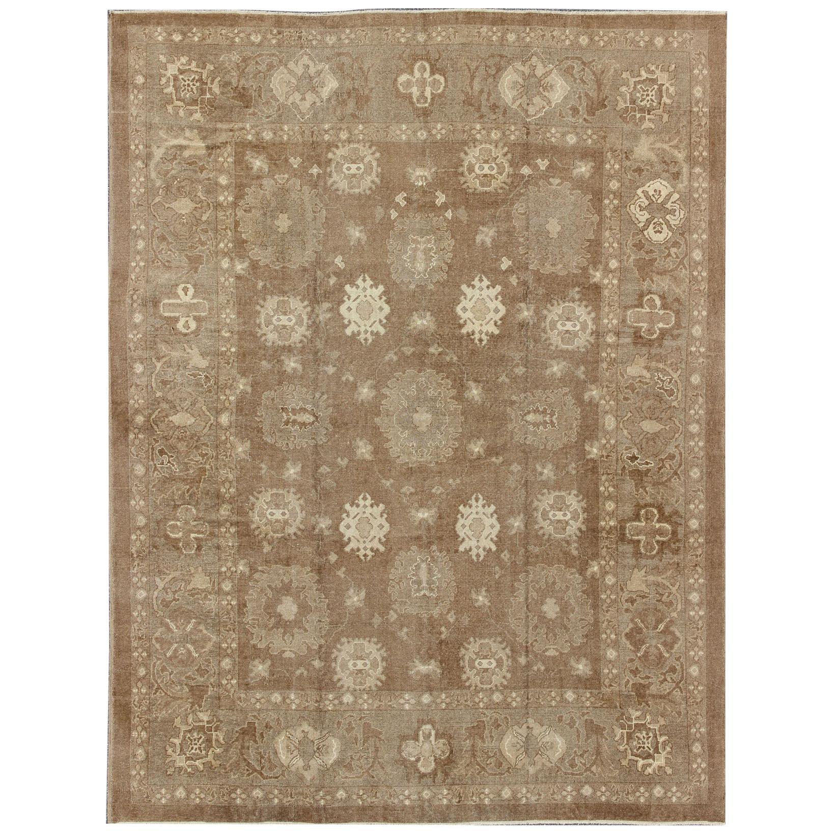 Large Vintage Turkish Rug in Light Brown Field, Taupe, Ivory and Earth Tones   For Sale