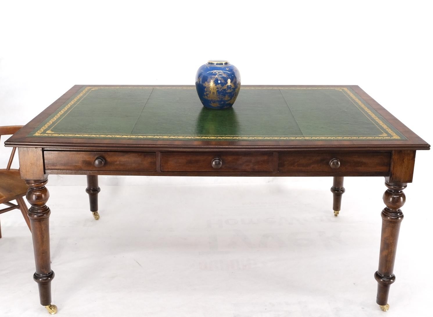 Large antique deep rectangle turned legs green leather top library table partners desk brass casters mint.