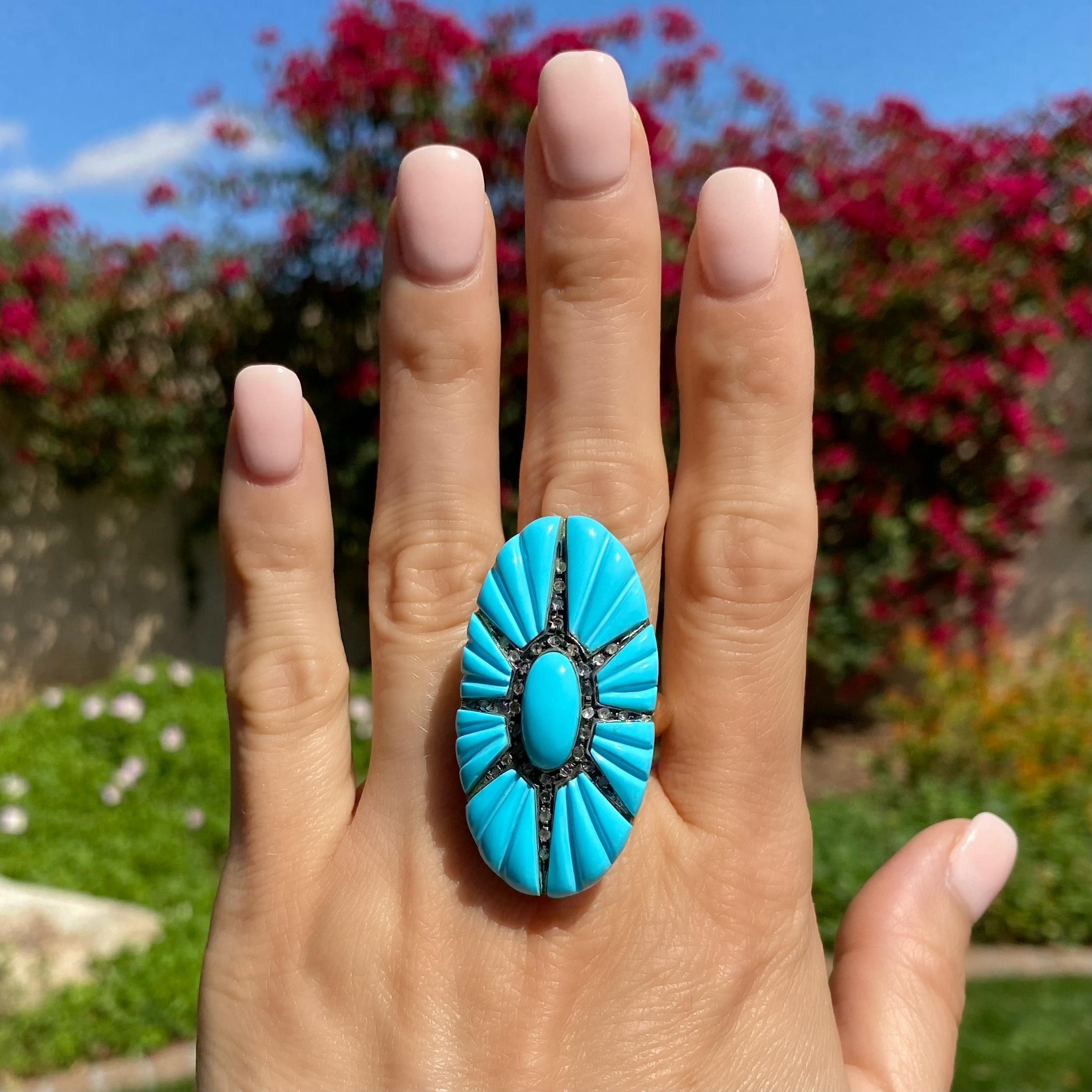 Fabulous Large Statement Ring featuring a Hand carved Oval Turquoise centering an eight ray star extending out with 35 Rose cut Diamonds, weighing approx. 0.25tcw, creating 8 Hand carved Turquoise sections outside the star making this a beautiful