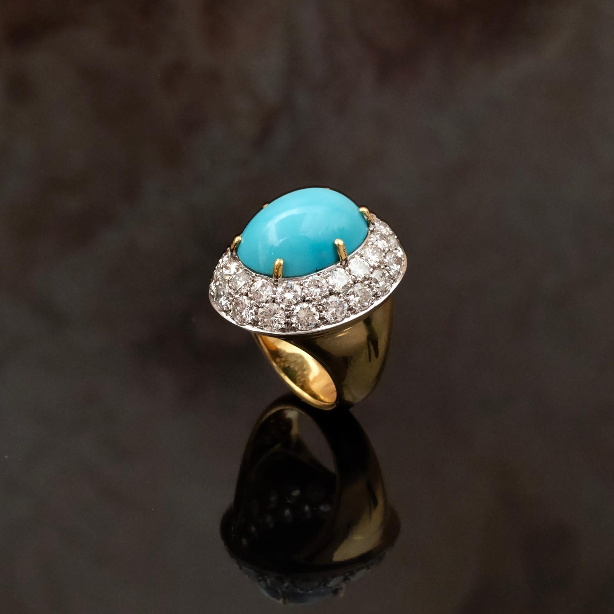 Introducing an exquisite Large Dome Shaped Cocktail Ring, a true masterpiece of Haute Joaillerie craftsmanship. 
At its heart lies a  17 x 12.3 mm. turquoise gemstone, displaying the perfect and most desired hue for turquoise. Surrounding this