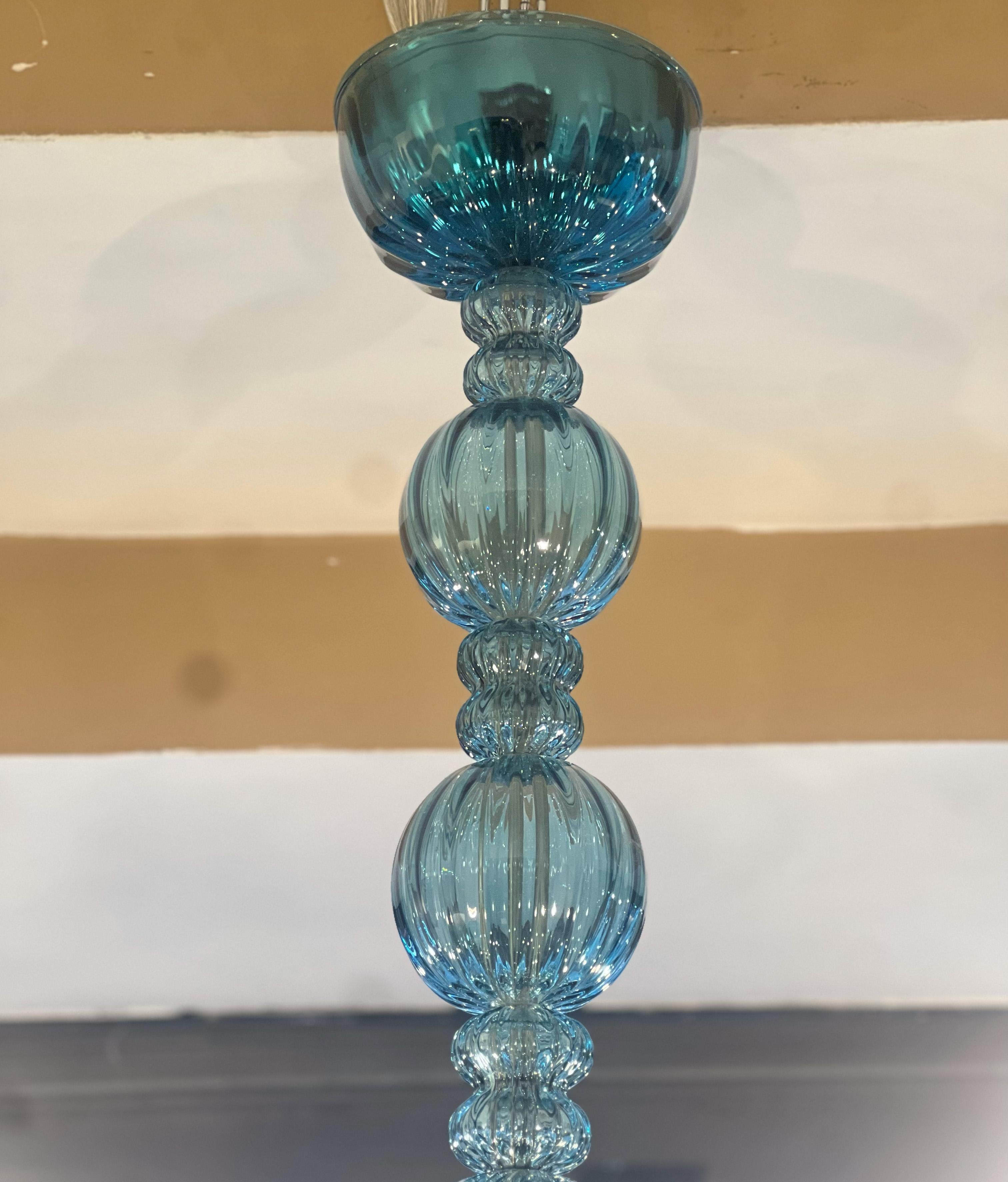 A circa 1960’s Italian blown glass chandelier with 12 lights.

Measurements:
Diameter: 45”
Current drop: 38” (adjustable)