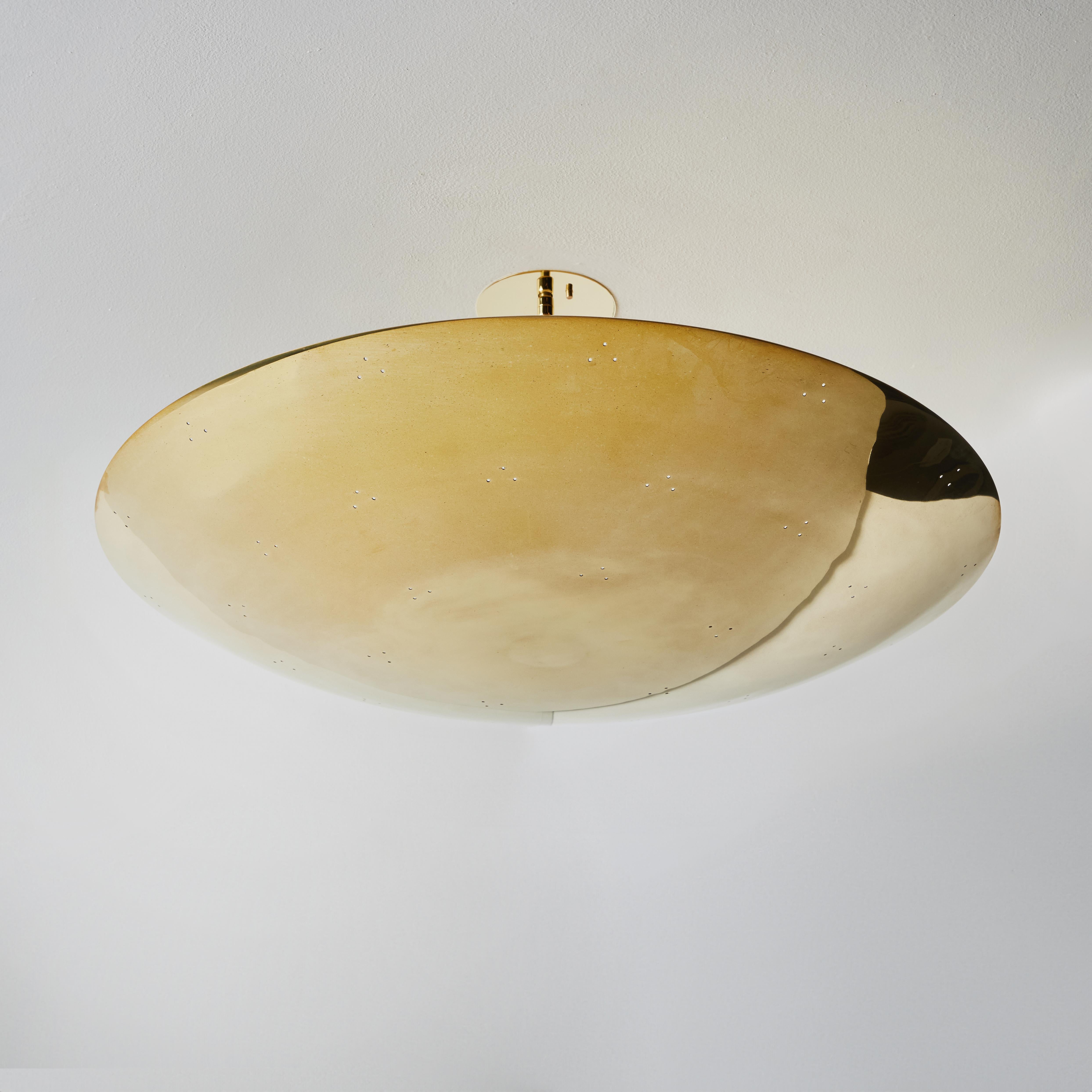 Large Raul Reyes 'Rey 30' Perforated Polished Brass Dome Ceiling Lamp.

Hand-fabricated in Los Angeles, these highly refined ceiling lamps are reminiscent of the iconic mid-century Finnish designs of Paavo Tynell and Lisa Johansson Pape. Executed in